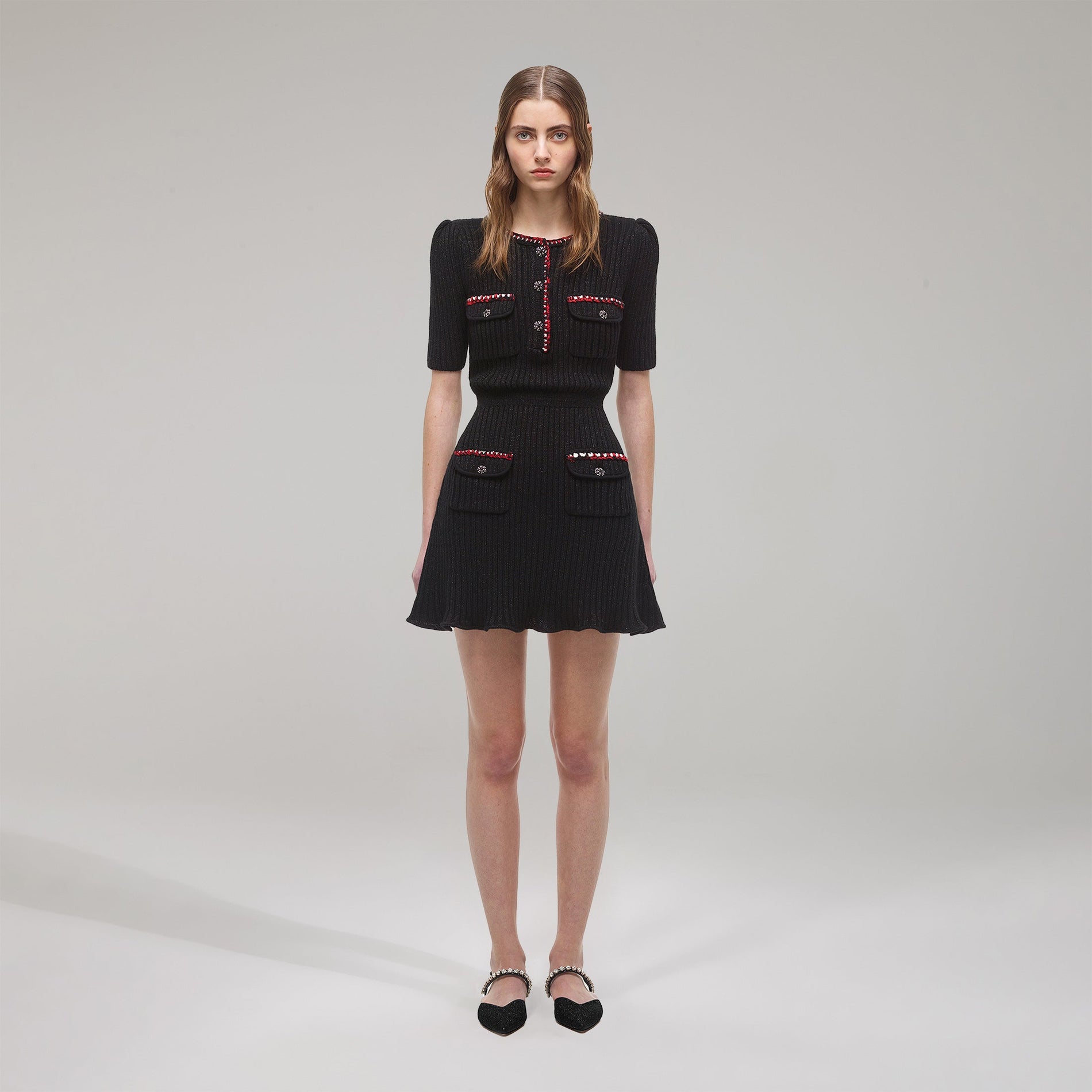 A woman wearing the Black Lurex Contrast Trim Mini Dress