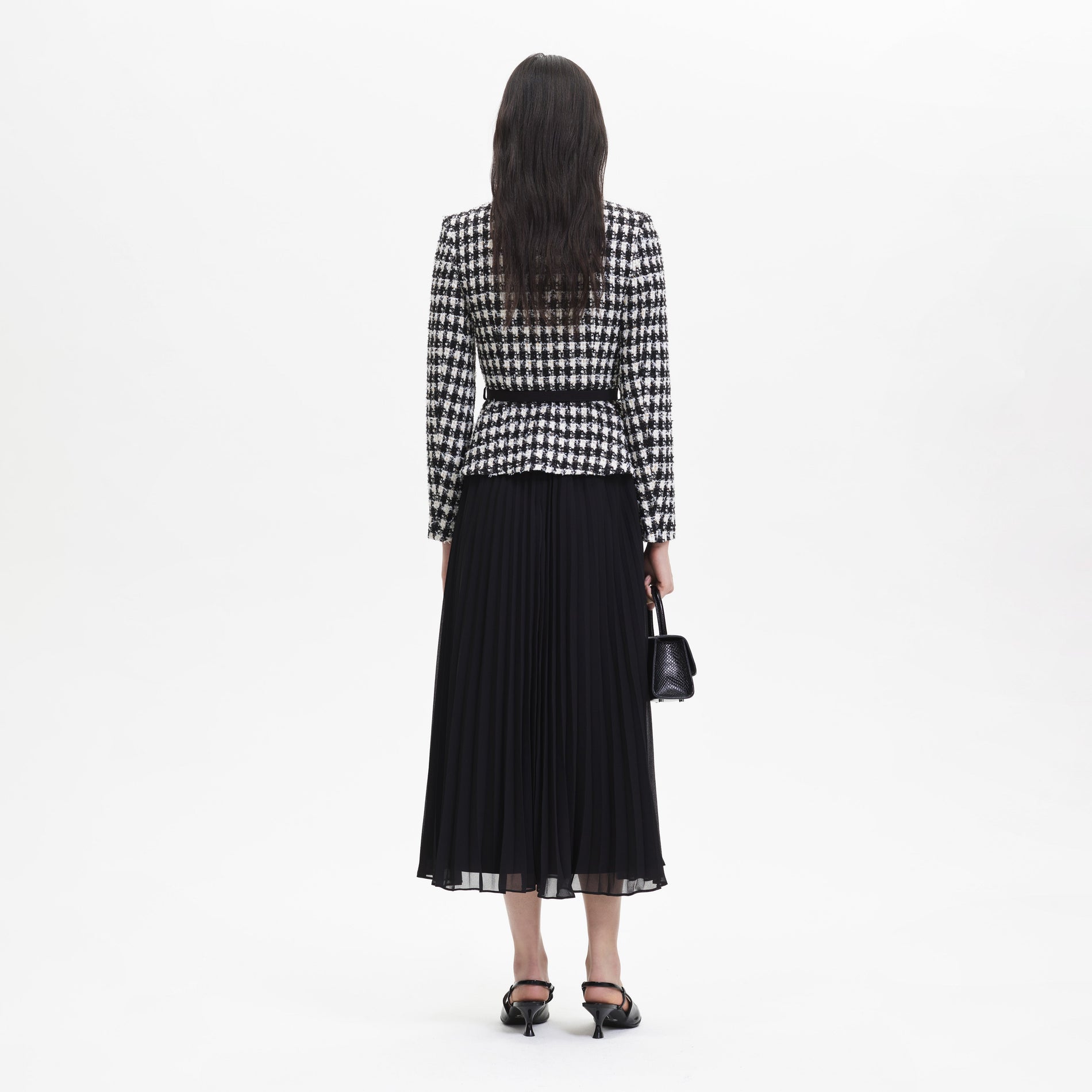 Back view of a woman wearing the Black Check Boucle Chiffon Midi Dress
