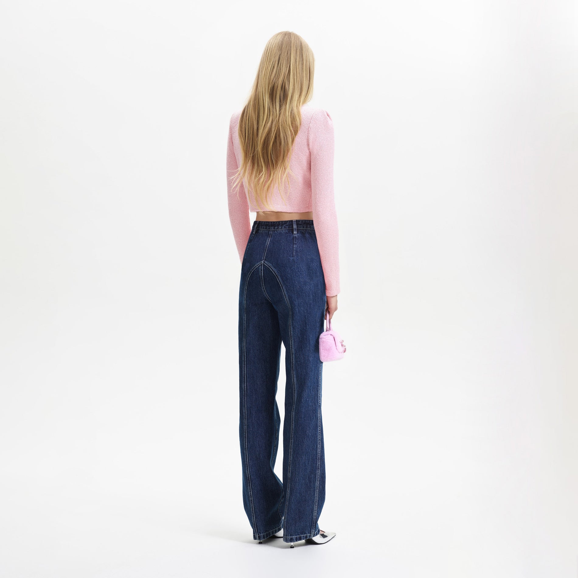 Back view of a woman wearing the Pink Faux Fur Collar Cardigan