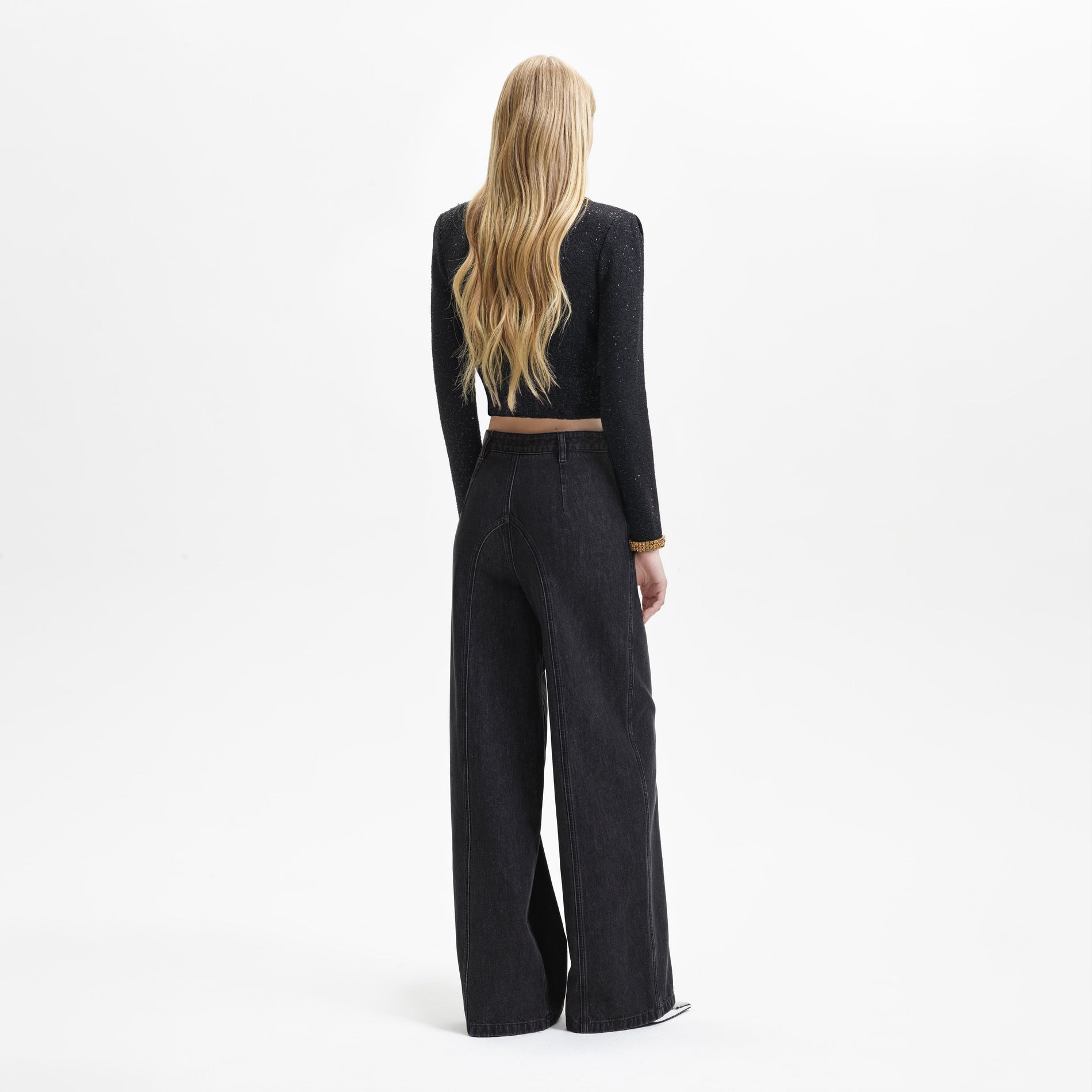 Back view of a woman wearing the Black Knit Gold Diamante Cardigan
