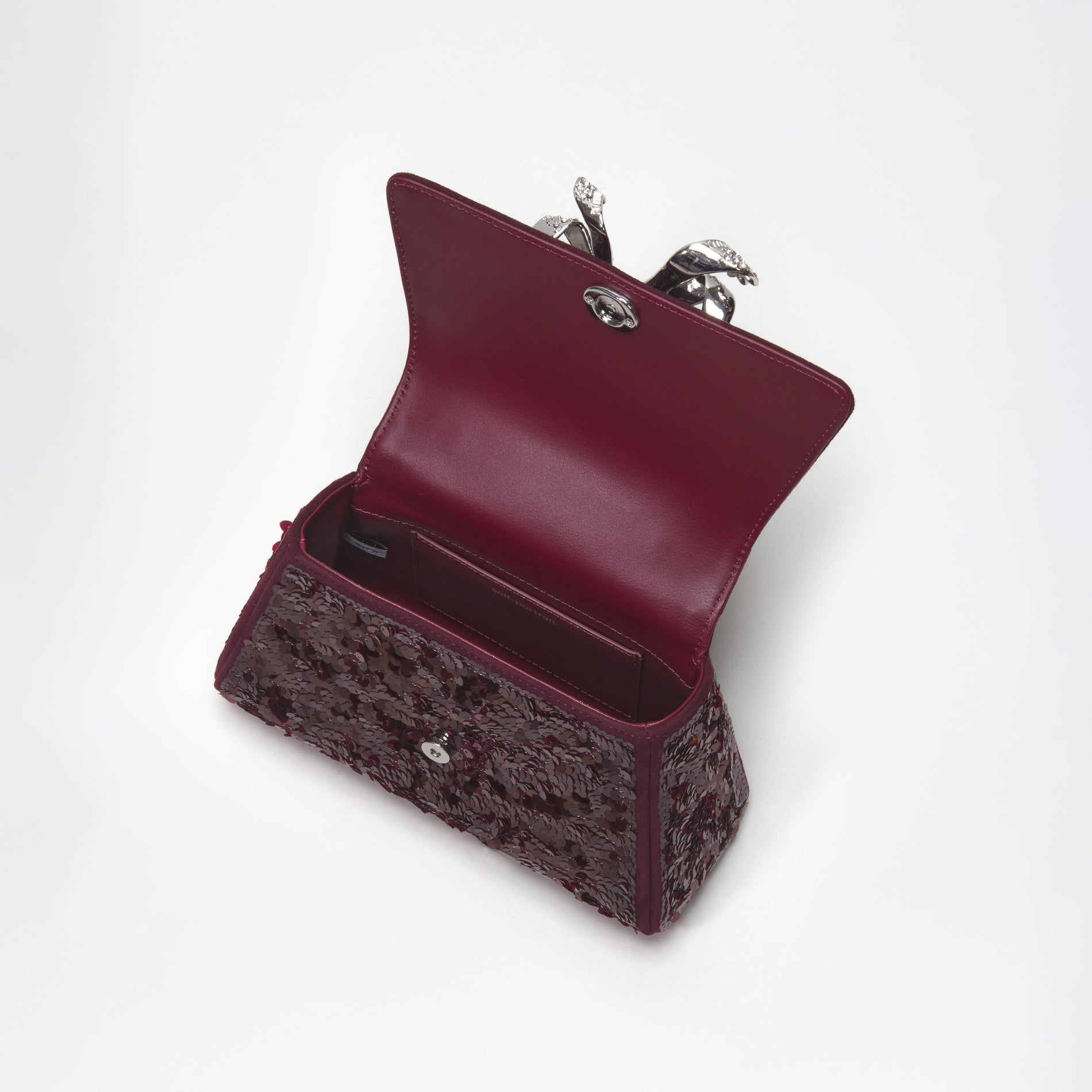 A close up of the fabric for the Red Sequin Bow Mini Shoulder Bag