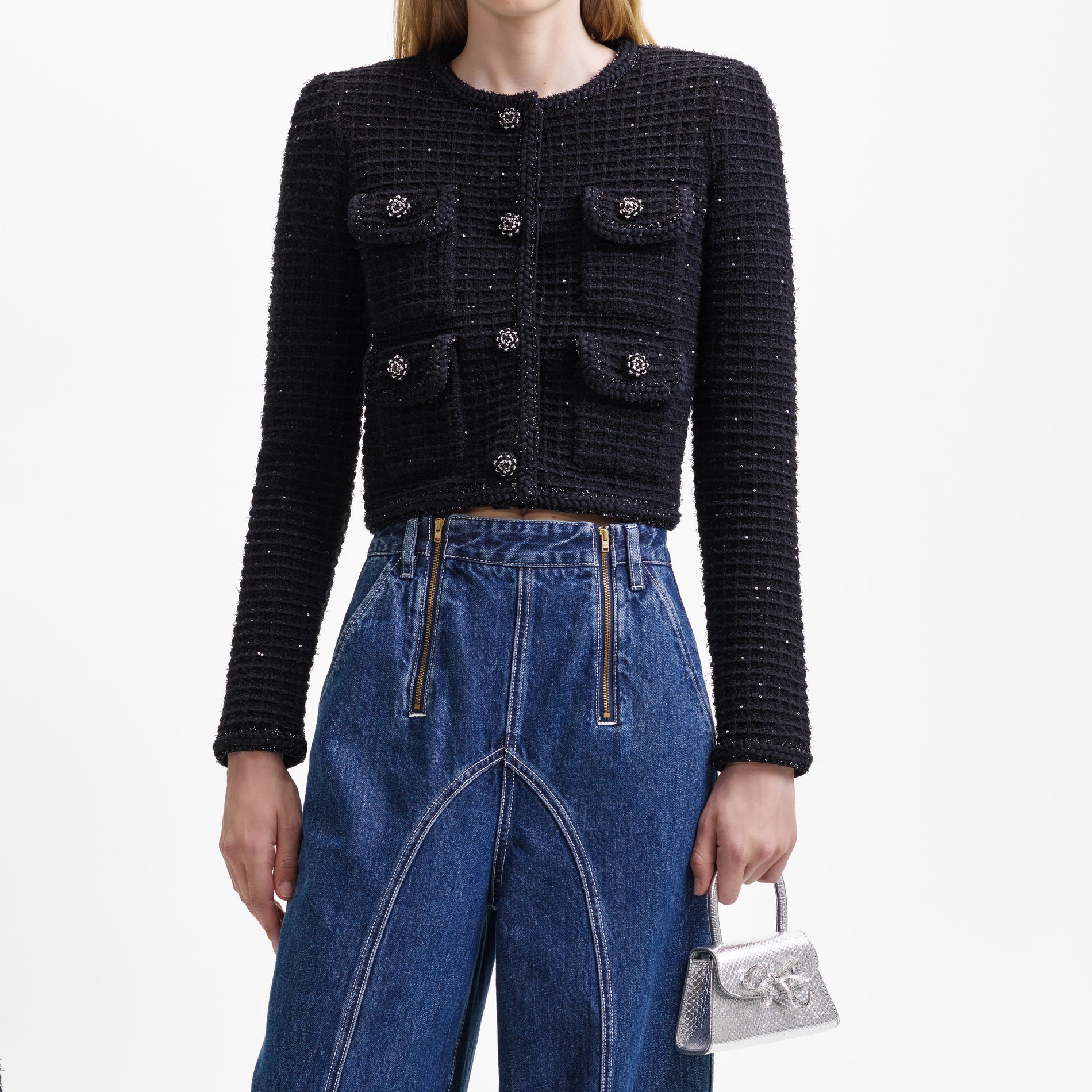 A close up of the fabric for the Black Sequin Textured Round Neck Knit Jacket