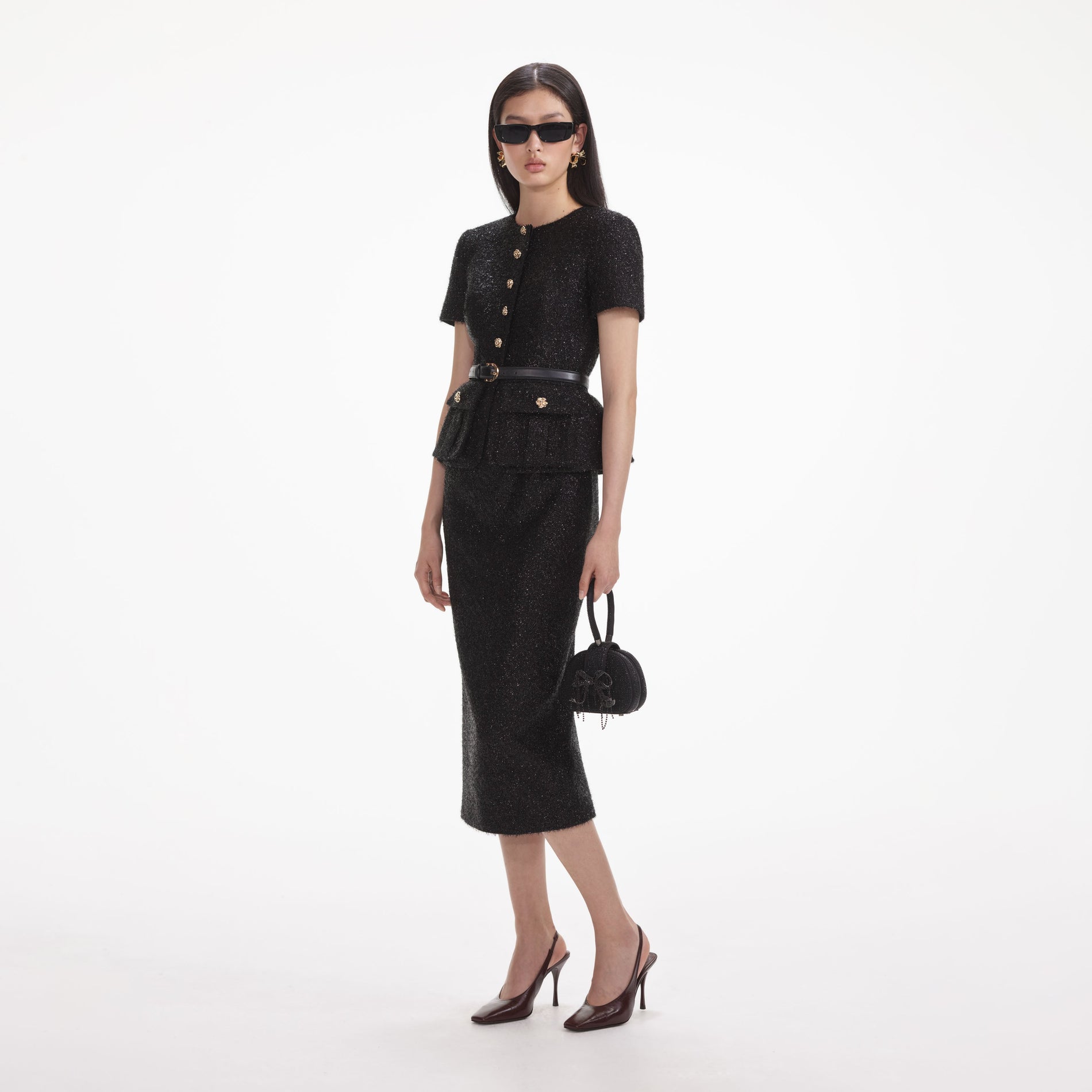 Side view of a woman wearing the Black Tinsel Boucle Tailored Midi Dress