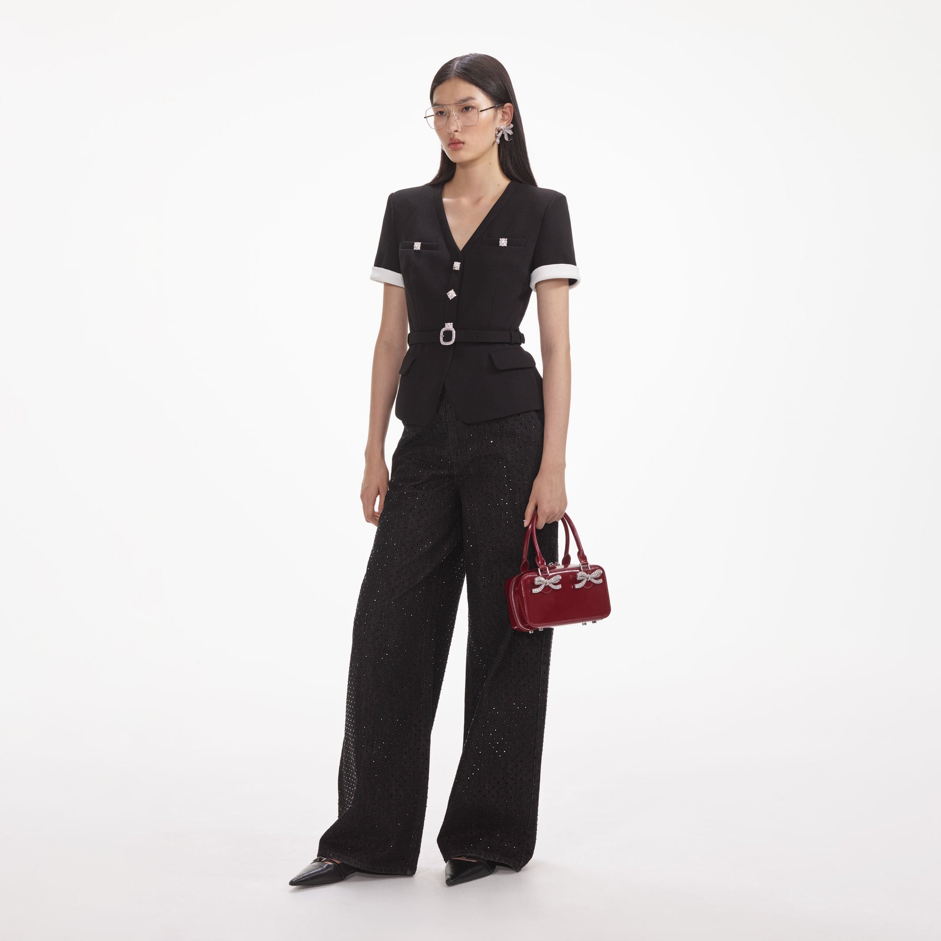 Side view of a woman wearing the Black Crepe Contrast Top