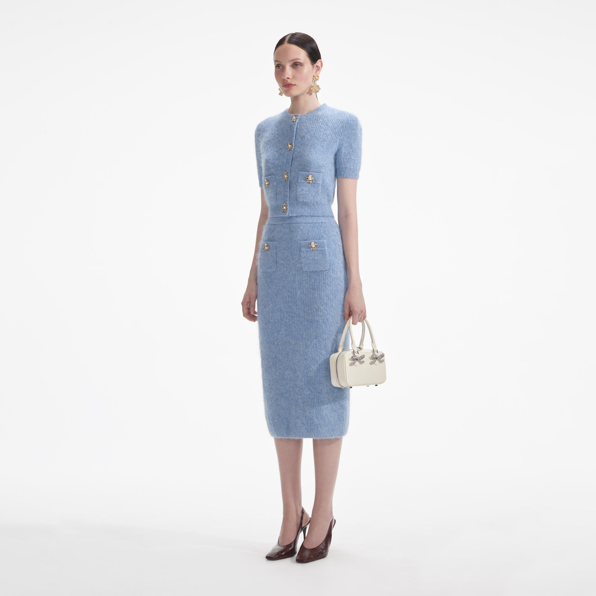 Side view of a woman wearing the Blue Soft Knit Top