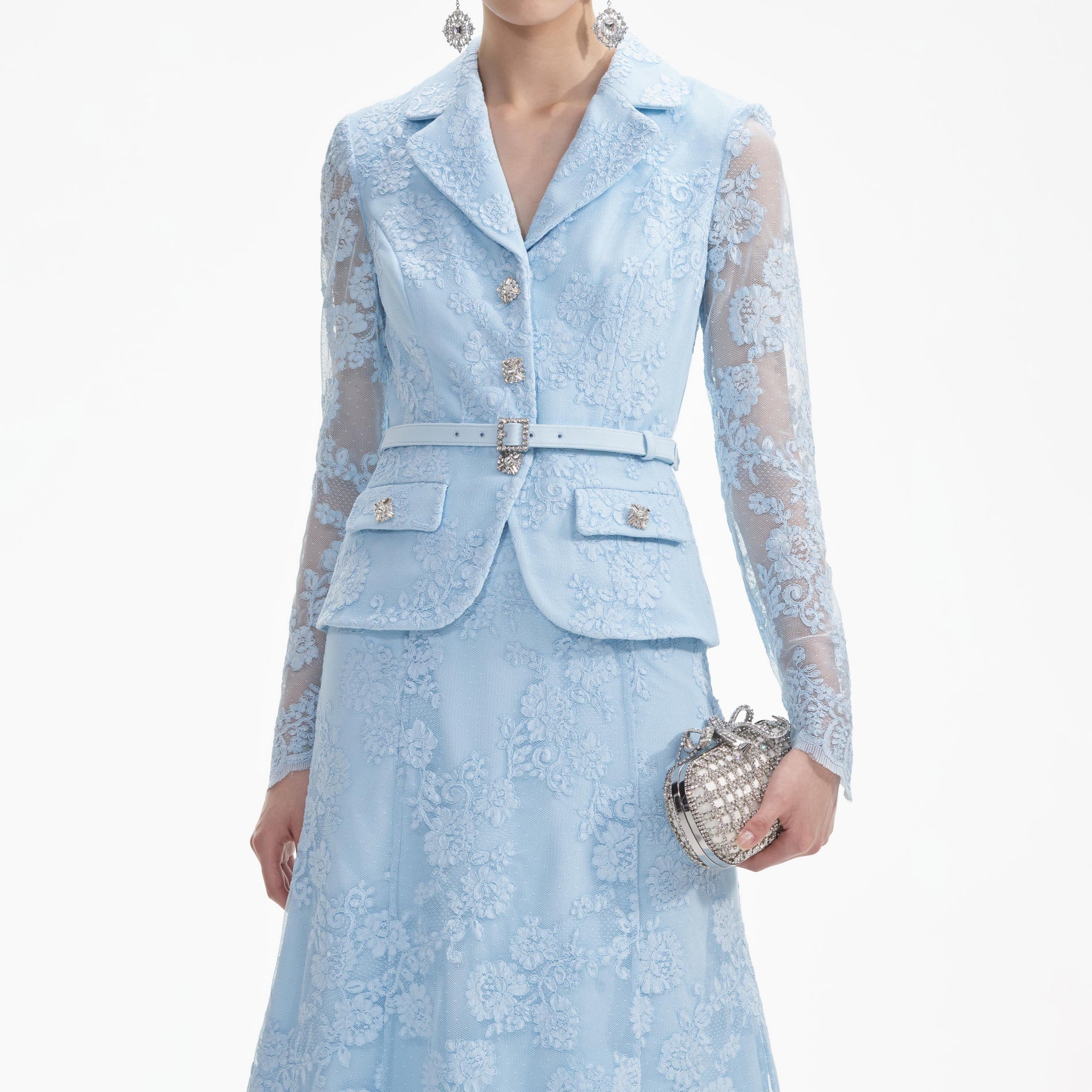 A close up of a woman wearing the Blue Lace Tailored Midi Dress