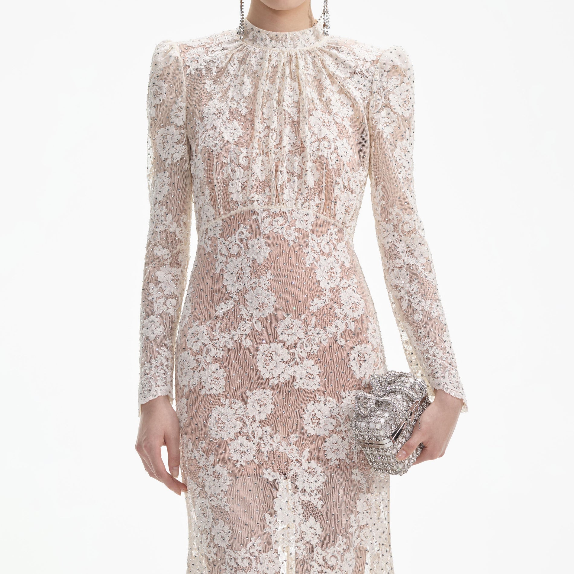 A close up of a woman wearing the White Rhinestone Lace Maxi Dress