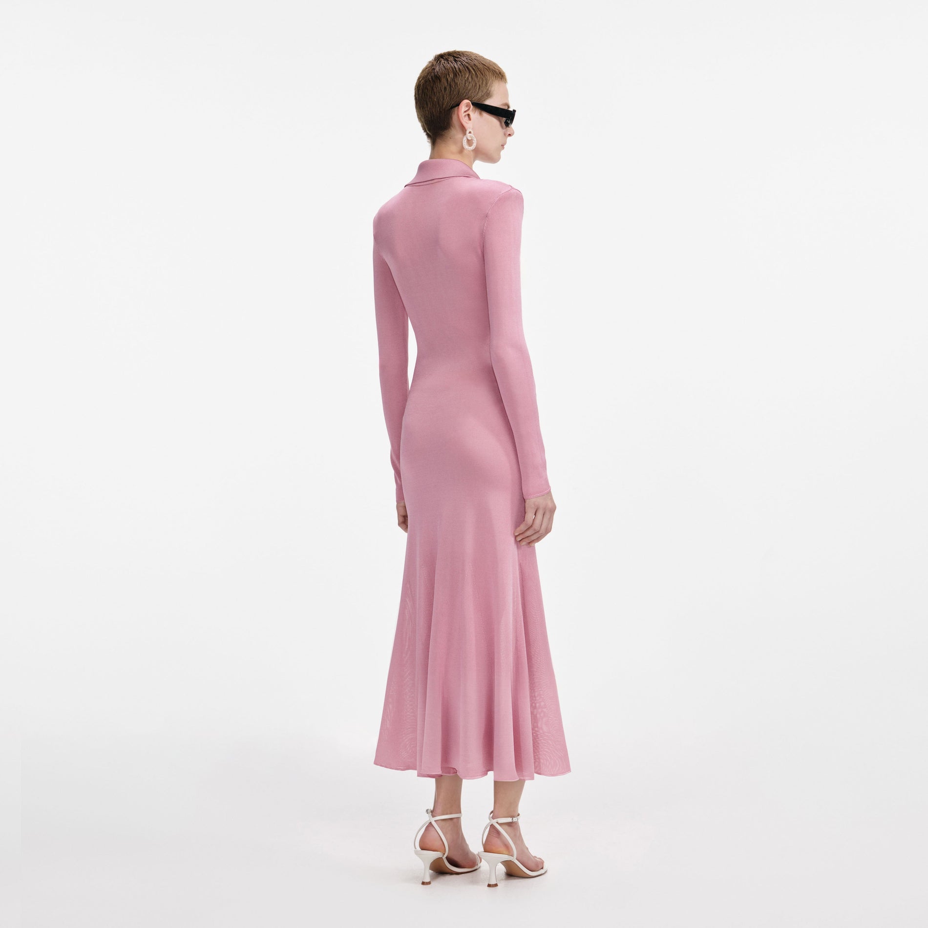 Back view of a woman wearing the Pink Viscose Knit Midi Dress