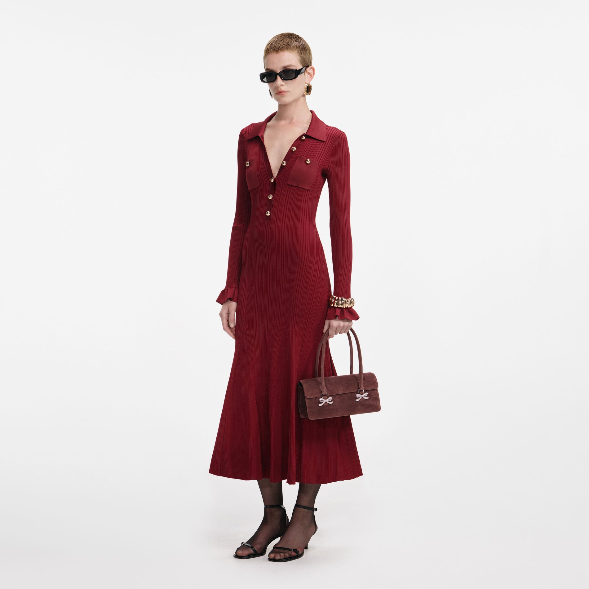Side view of a woman wearing the Burgundy Ribbed Knit Midi Dress