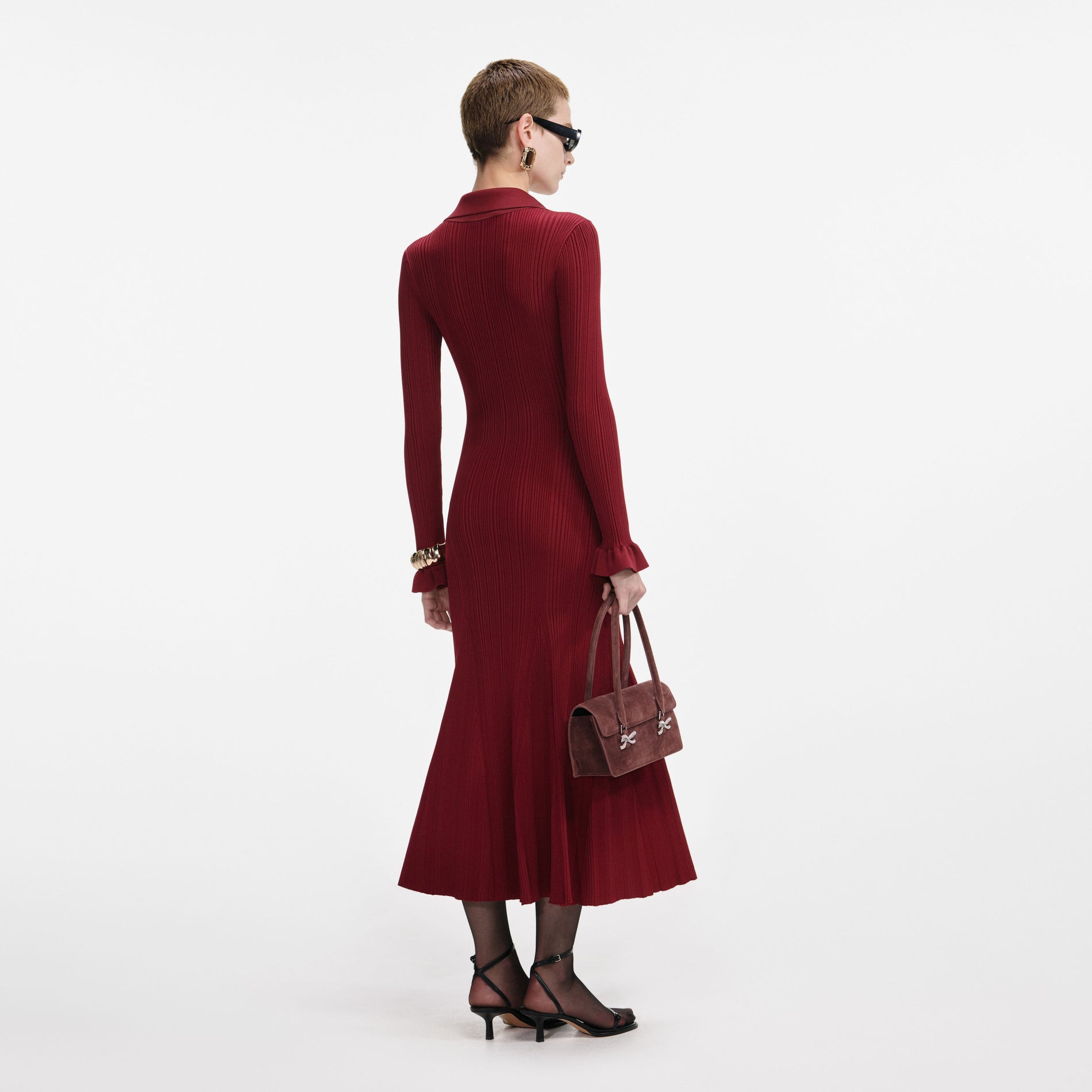 Back view of a woman wearing the Burgundy Ribbed Knit Midi Dress