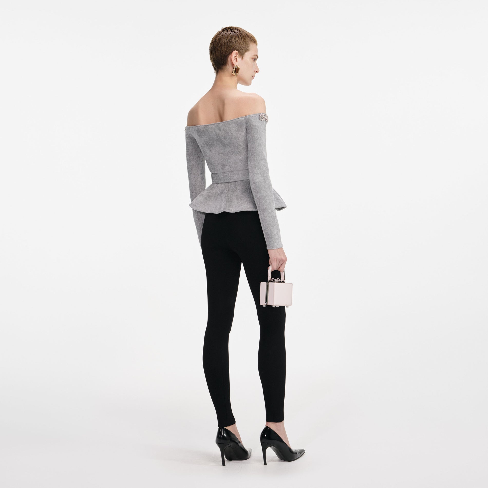 Back view of a woman wearing the Grey Chenille Knit Crystal Trim Top