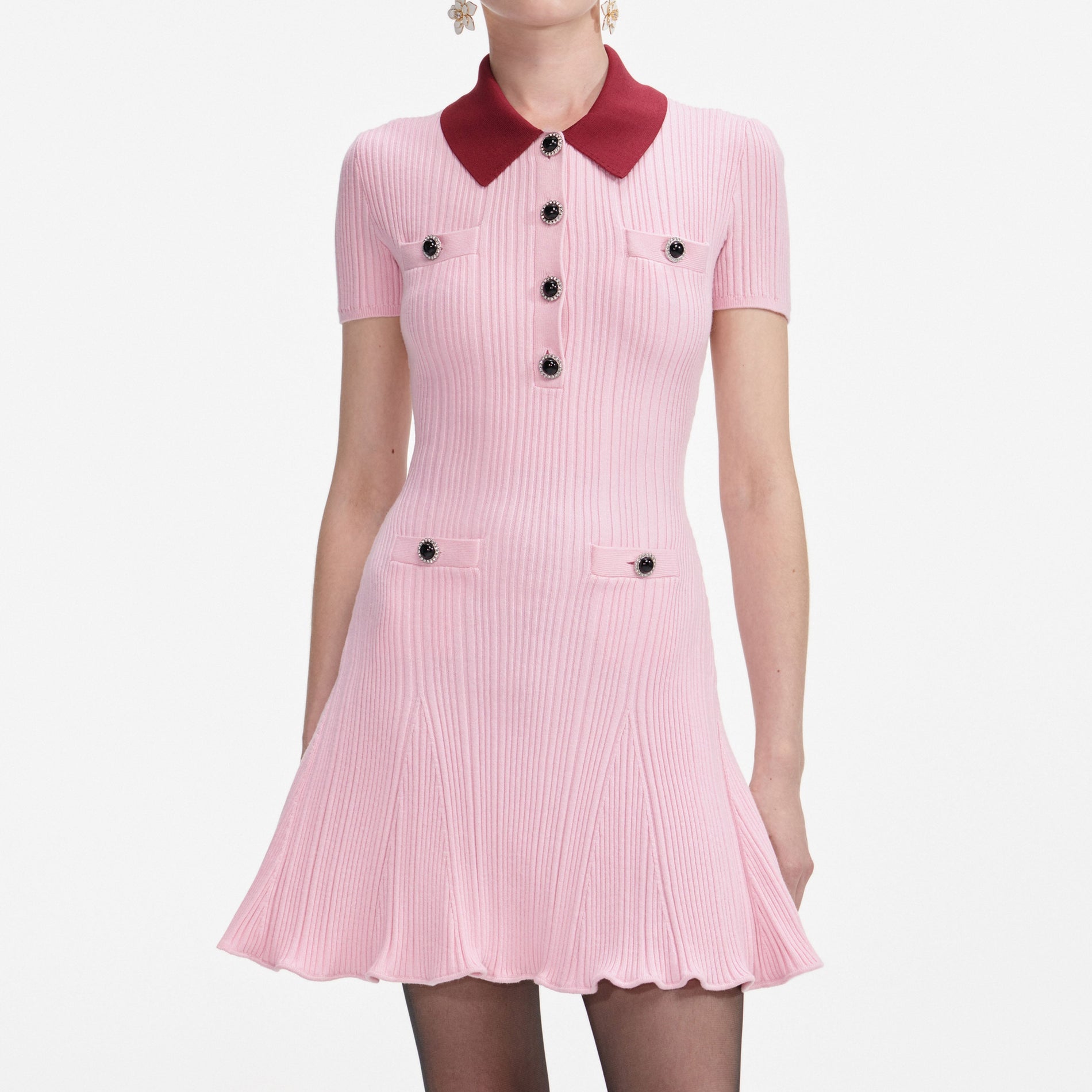 A close up of a woman wearing the Pink Contrast Collar Knit Mini Dress