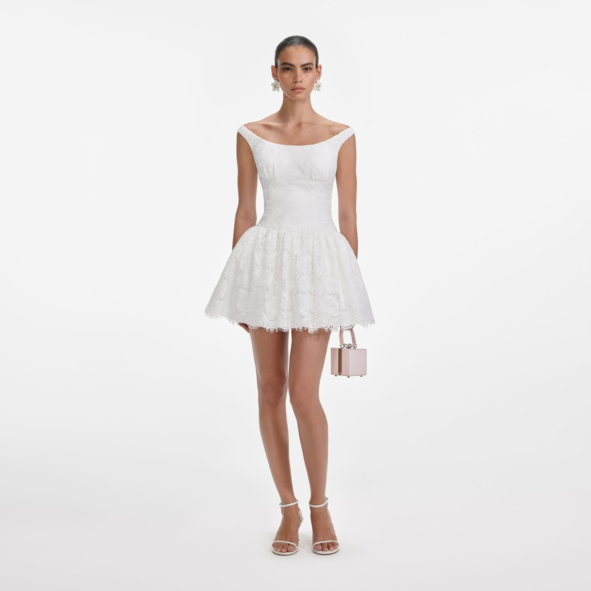 Front view of a woman wearing the White Floral Lace Mini Dress