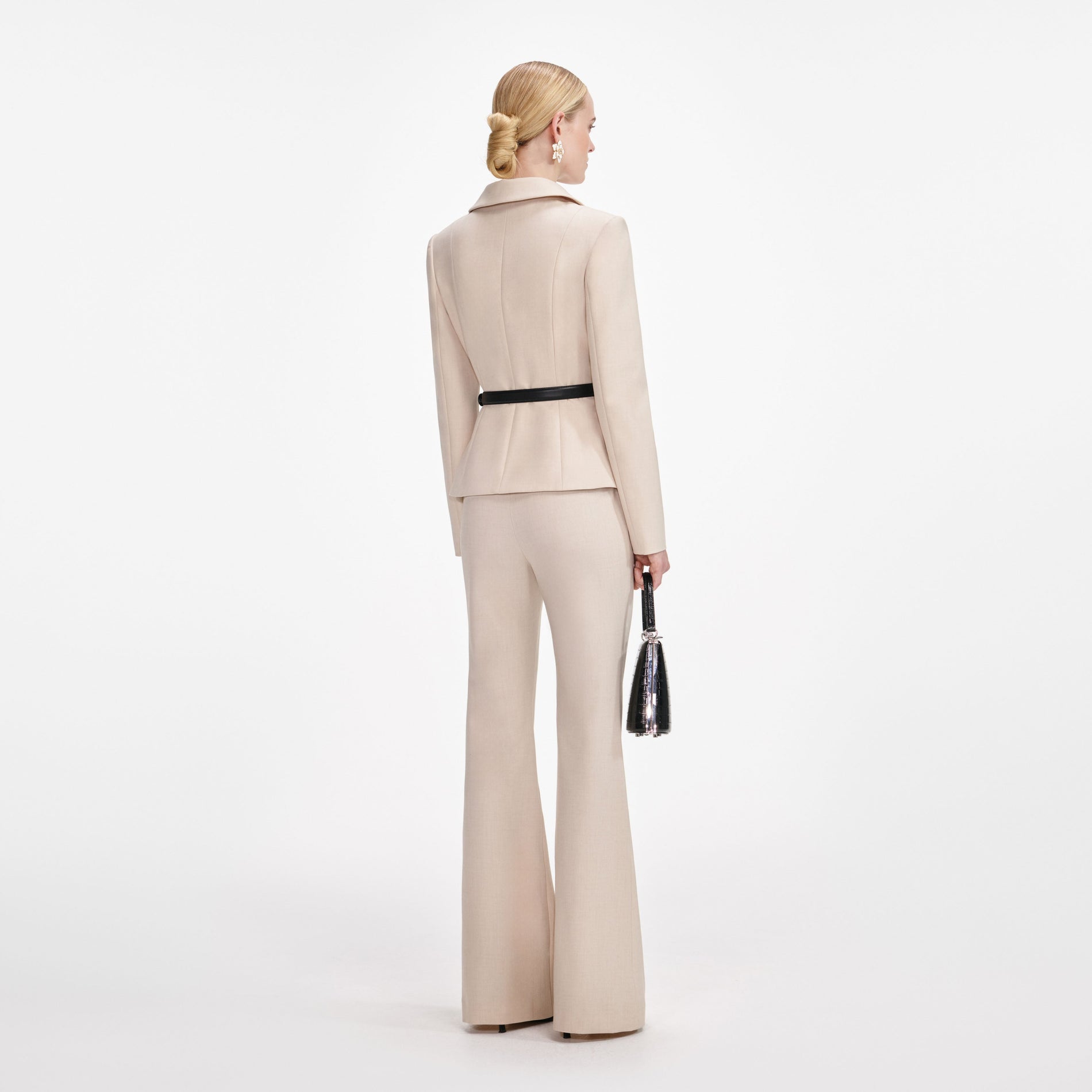 Back view of a woman wearing the Beige Twill Jumpsuit