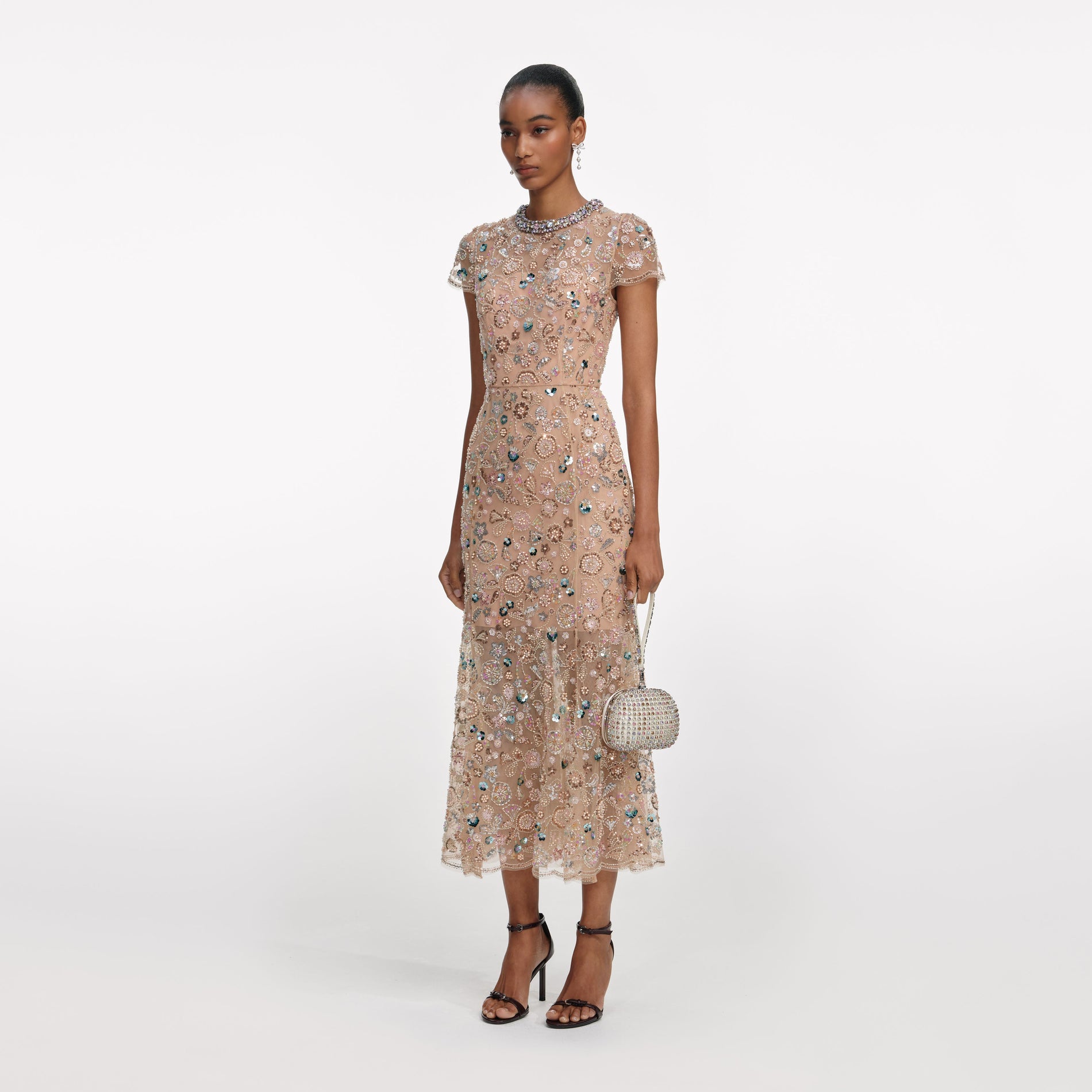 Side view of a woman wearing the Champagne Sequin Embroidered Midi Dress