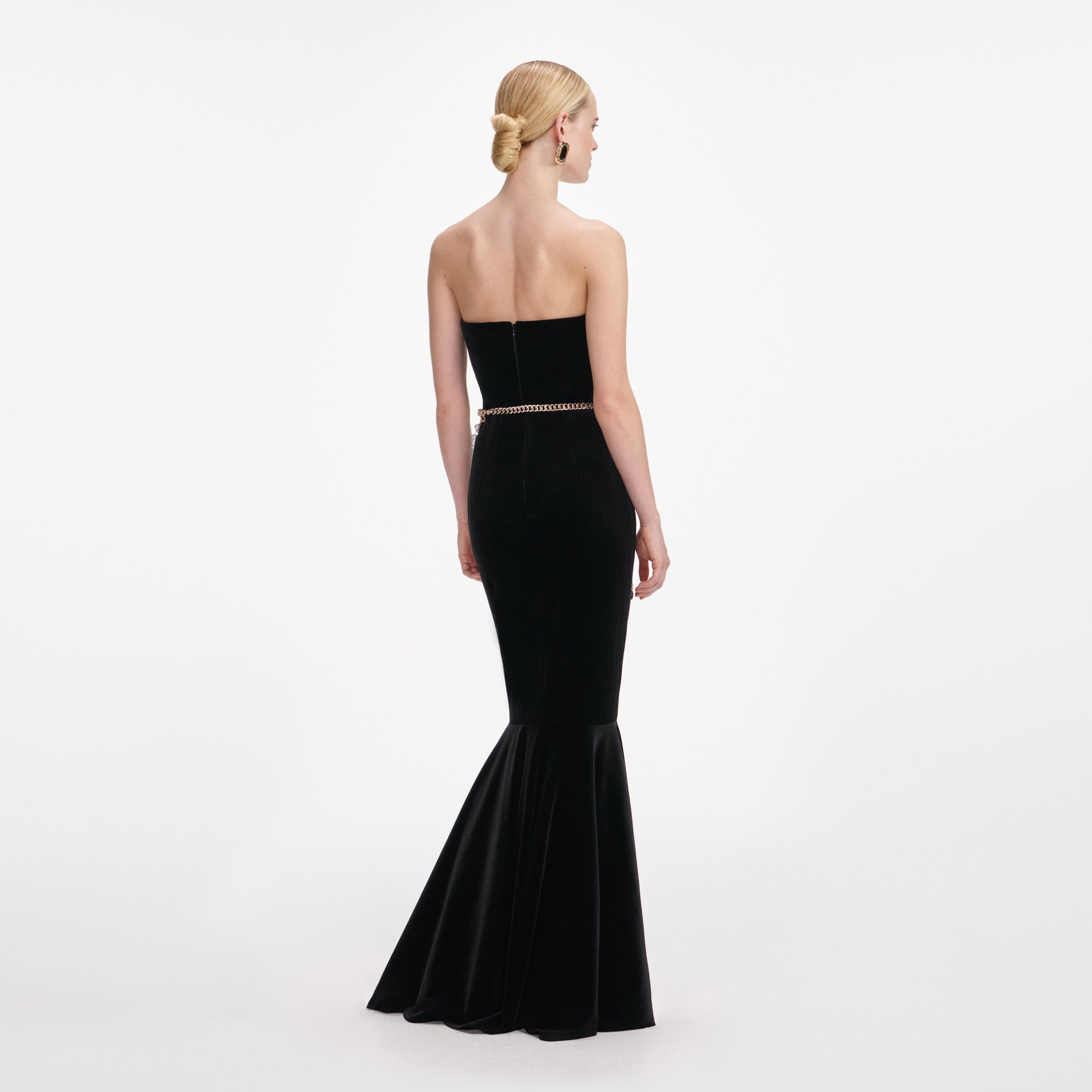 Back view of a woman wearing the Black Velvet Chain Belt Maxi Dress