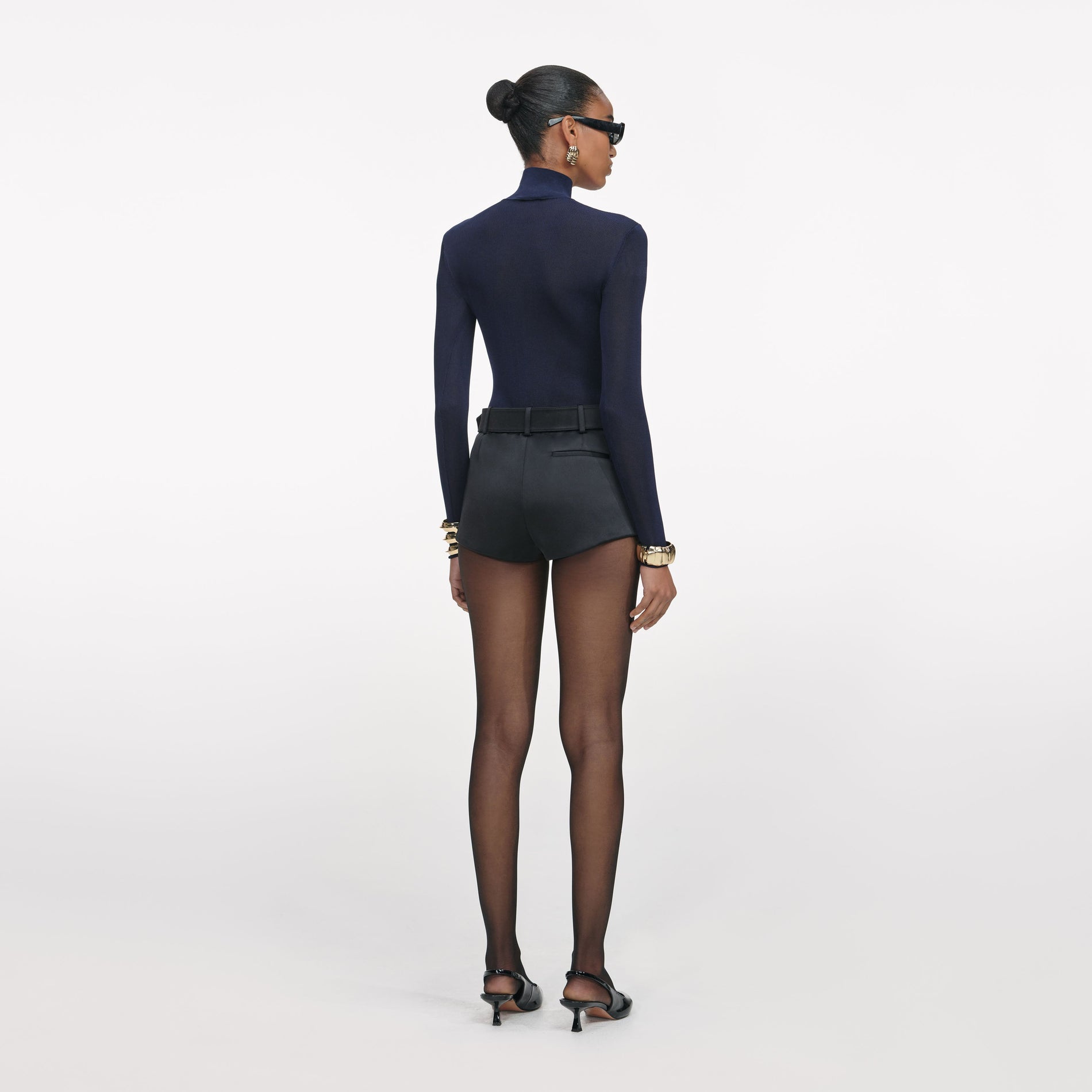 Back view of a woman wearing the Navy Viscose Knit Top