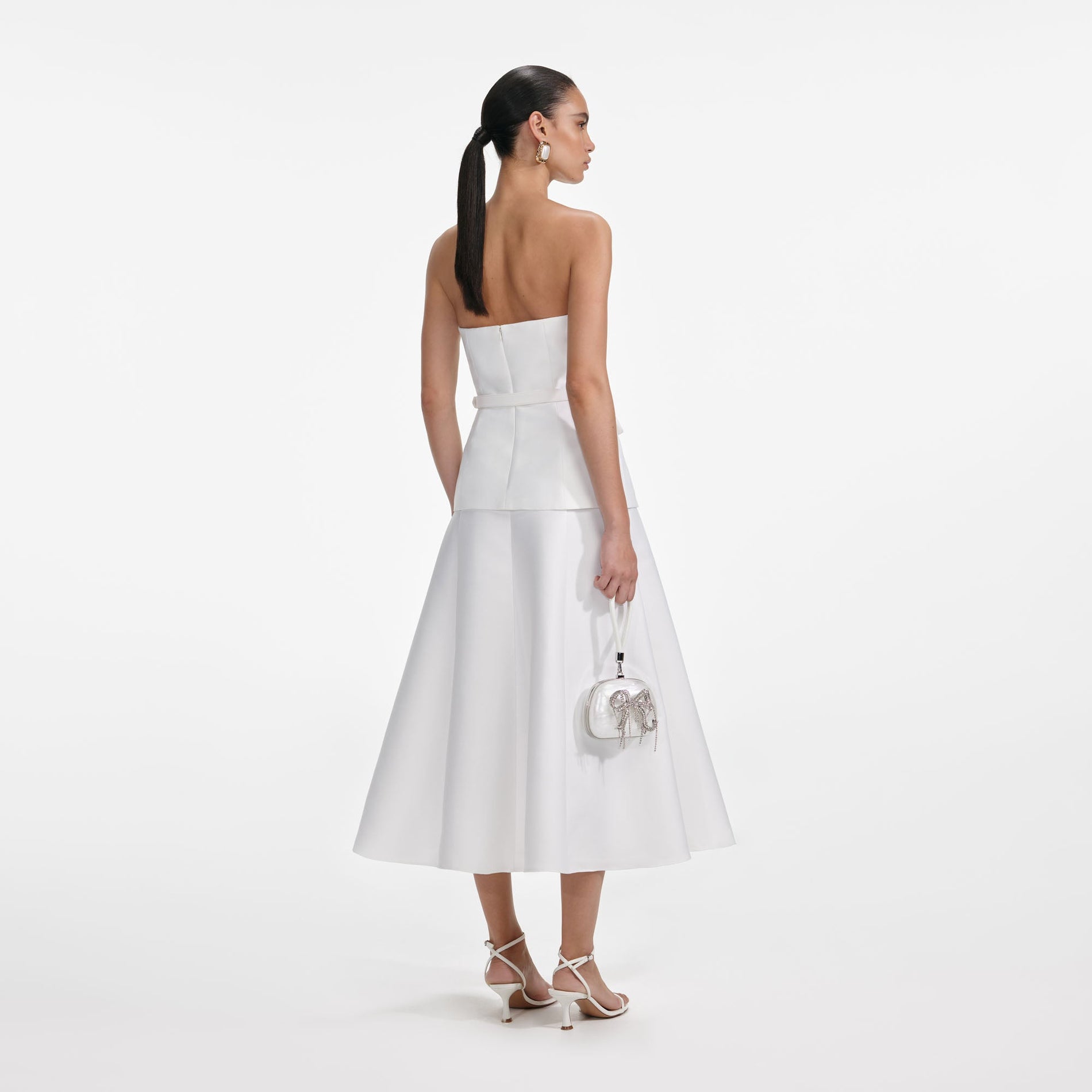 Back view of a woman wearing the White Taffeta Bandeau Midi Dress