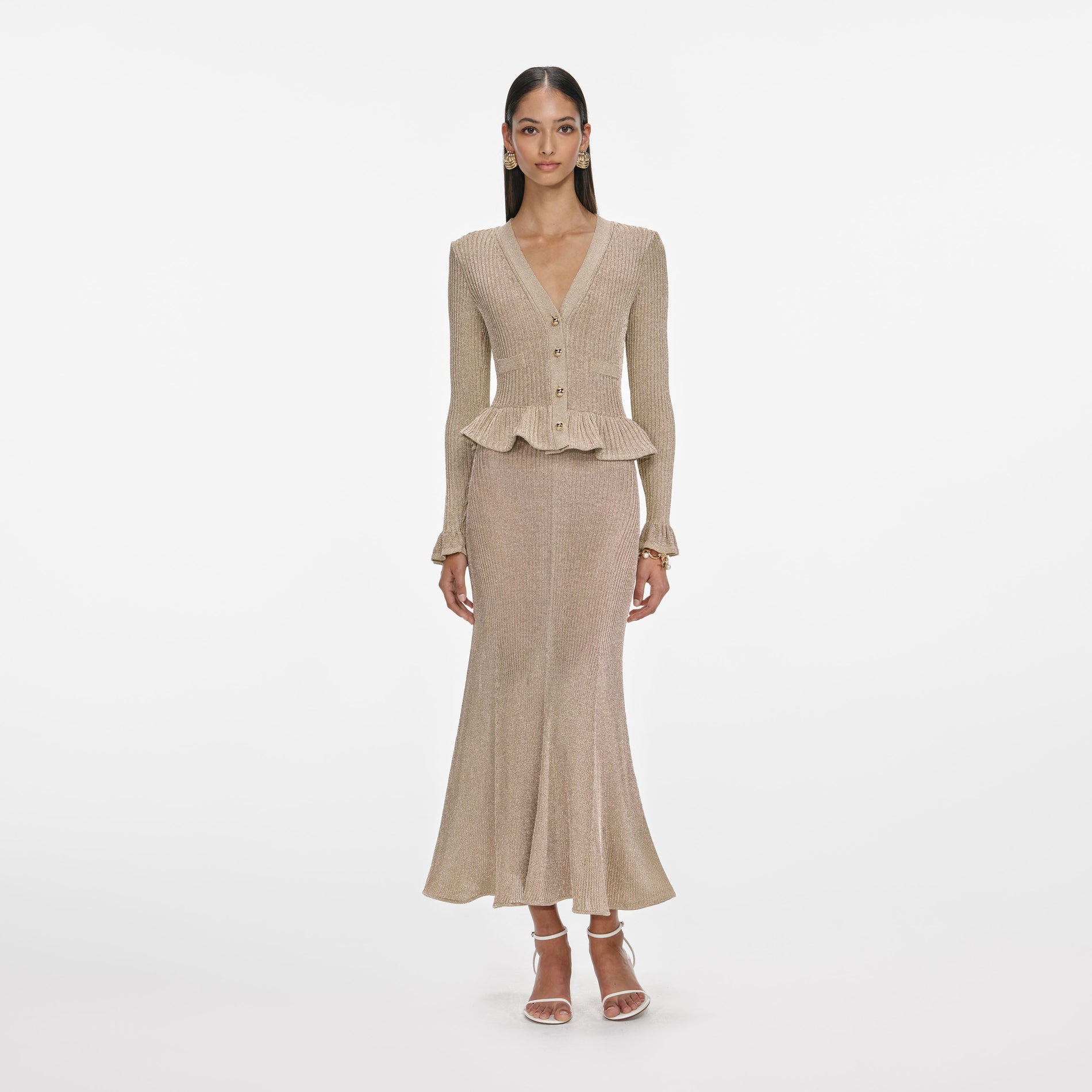 Front view of a woman wearing the Gold Lurex Peplum Knit Midi Dress