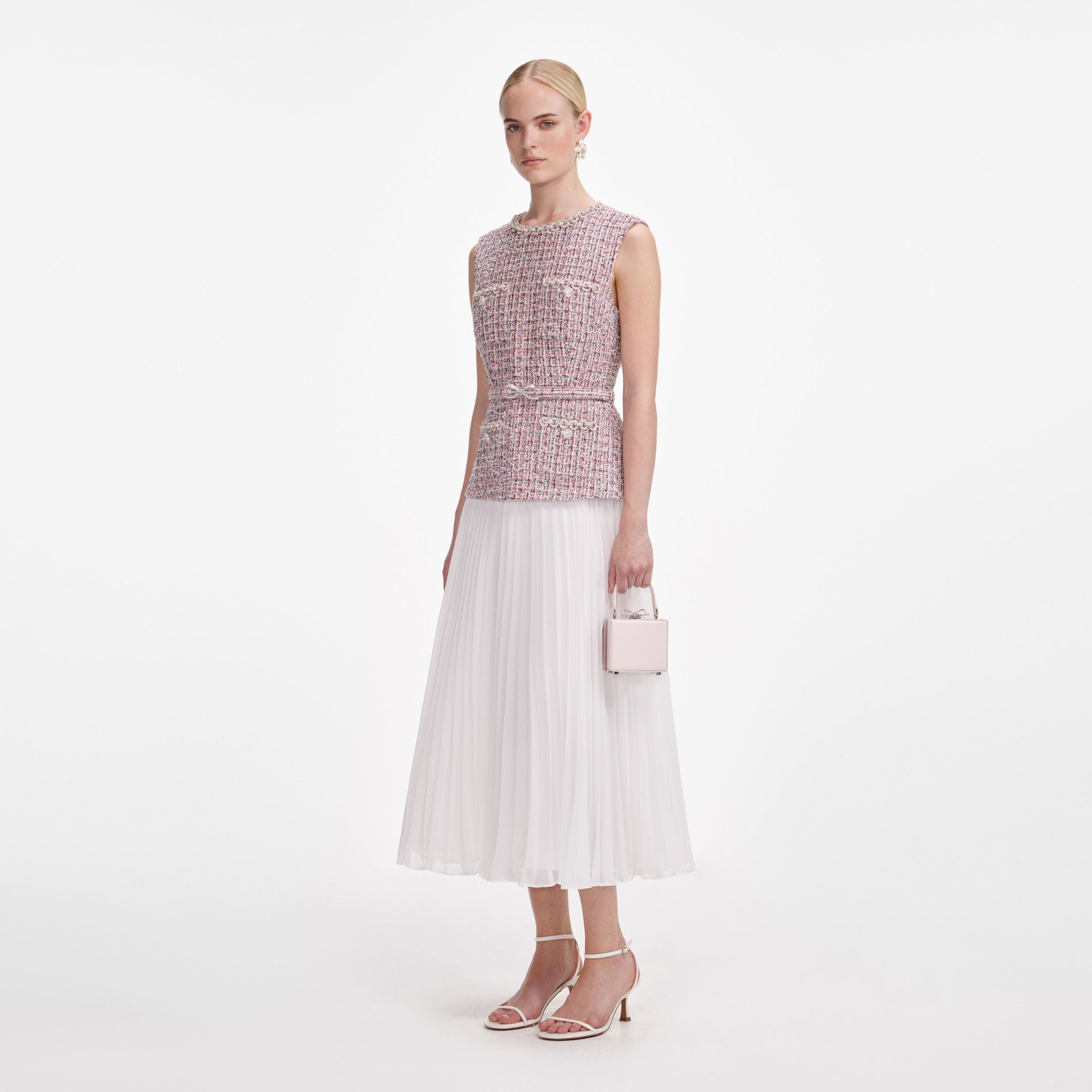 Side view of a woman wearing the Pink Boucle Chiffon Midi Dress