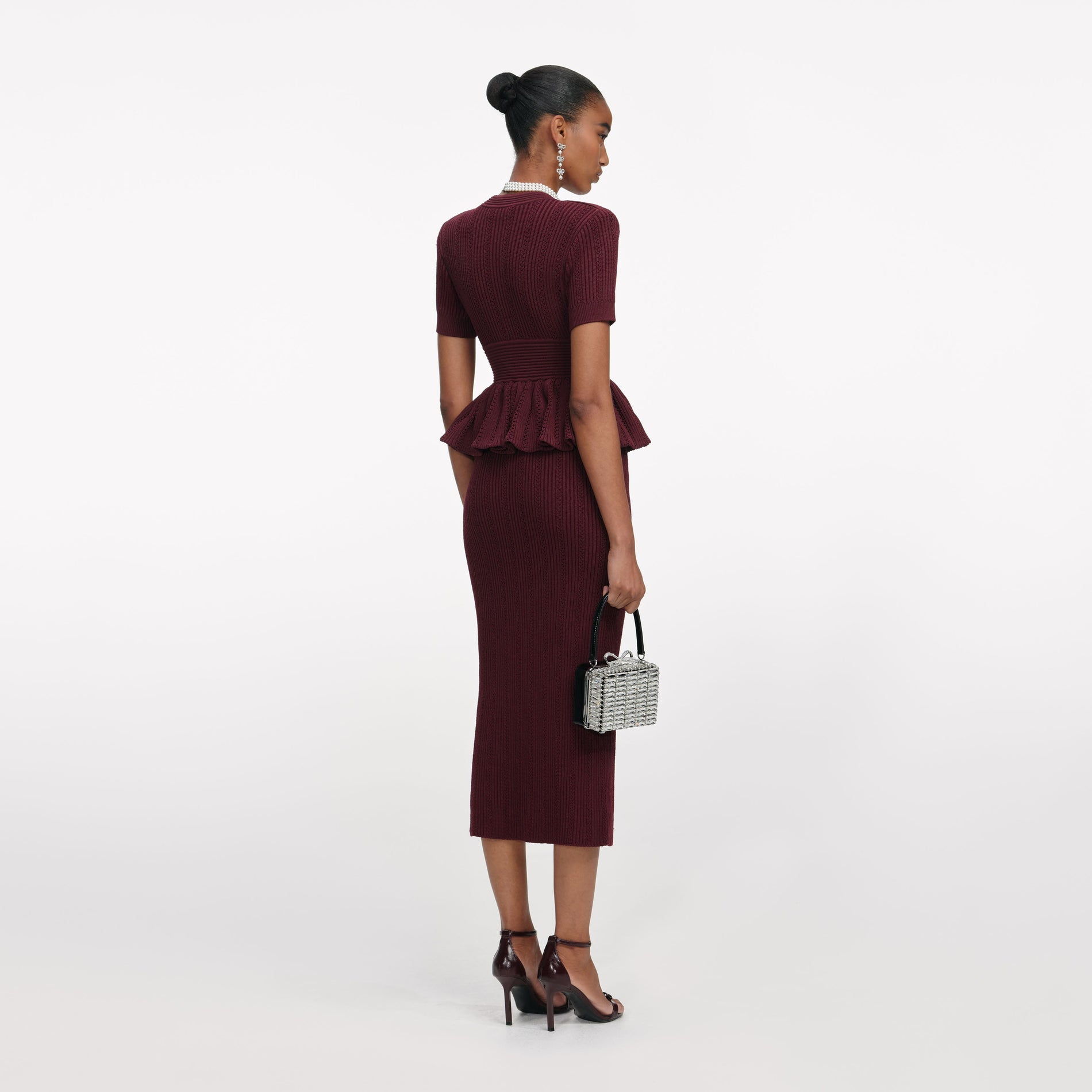 Back view of a woman wearing the Bordeaux Pointelle Knit Midi Dress
