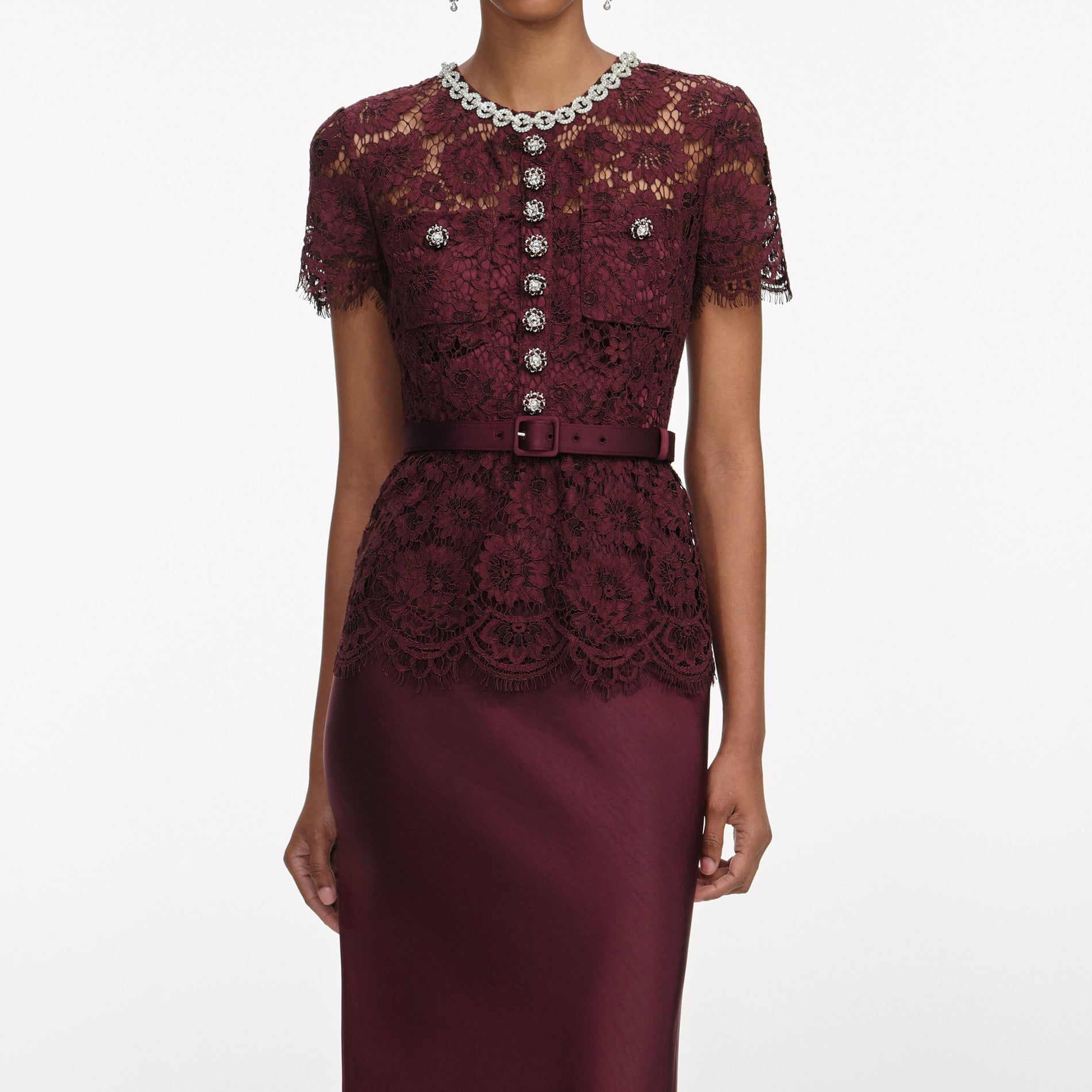 A close up of a woman wearing the Champagne Sequin Embroidered Midi Dress