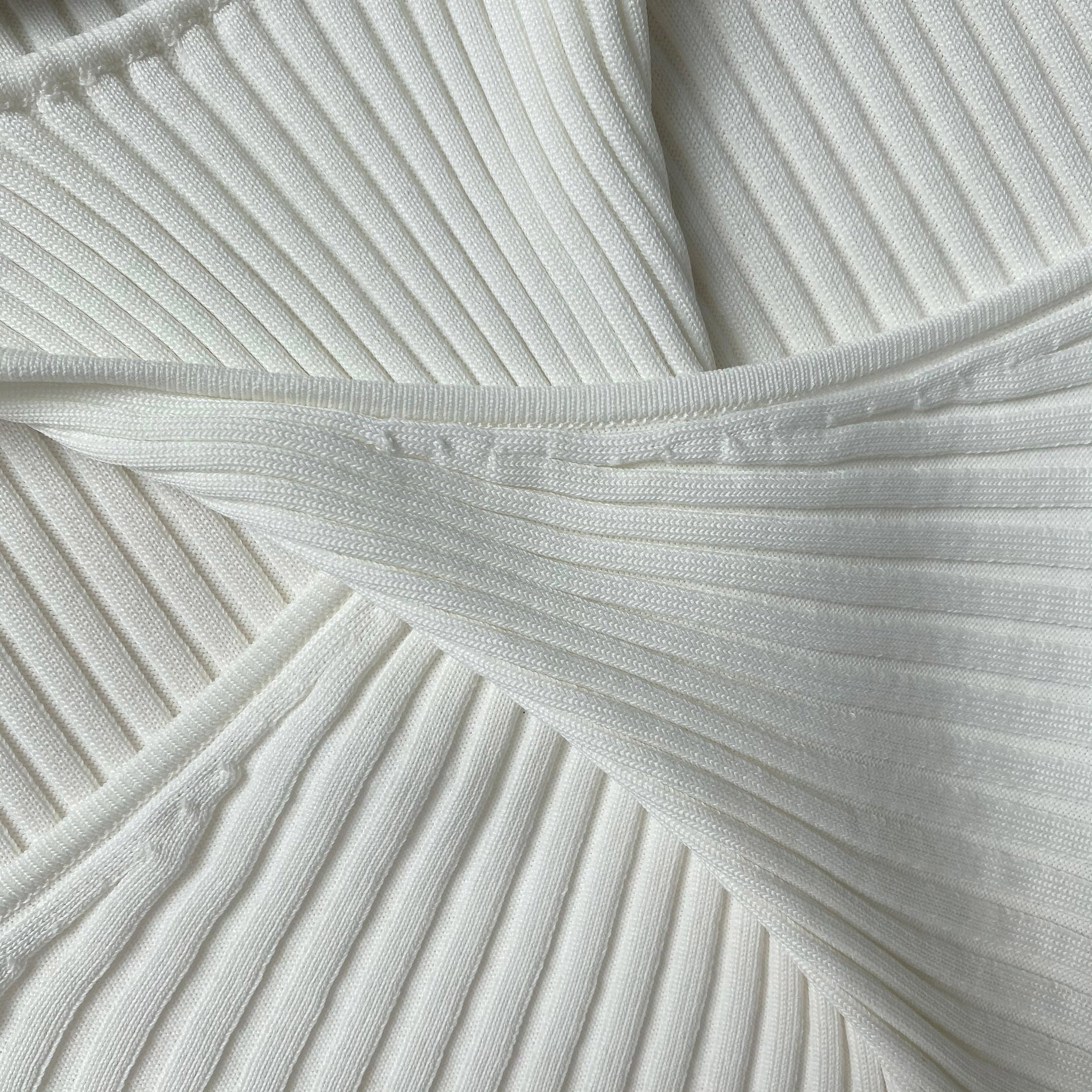 A close up of the fabric for the White Ribbed Knit Cut Out Midi Dress