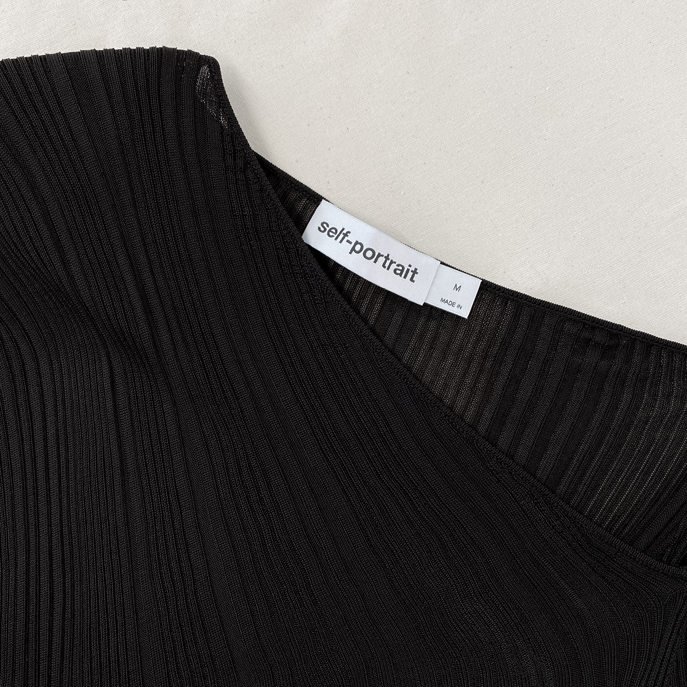 A close up of the fabric for the Black Knit Midi Dress