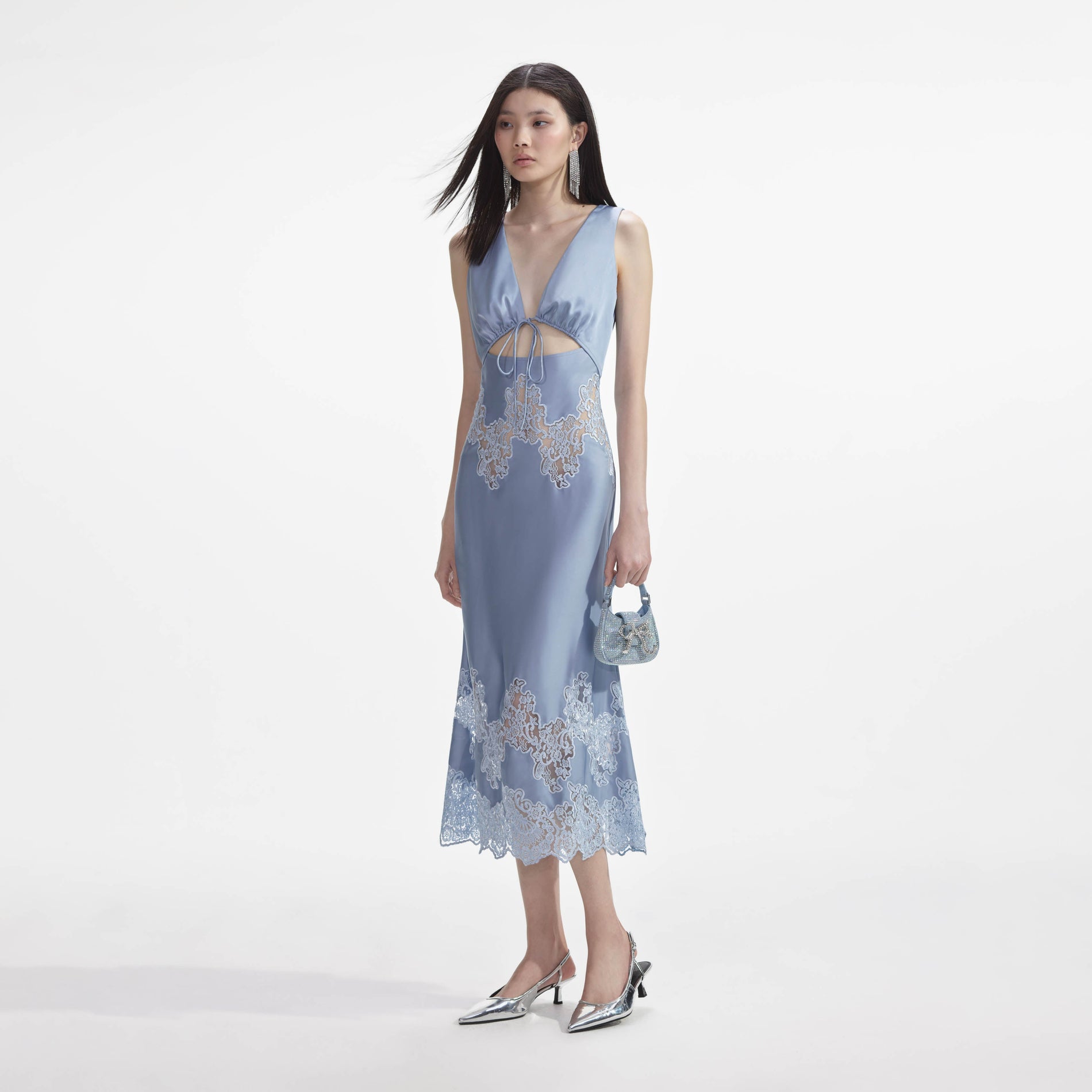 Side view of a woman wearing the Blue Satin Lace Insert Midi Dress