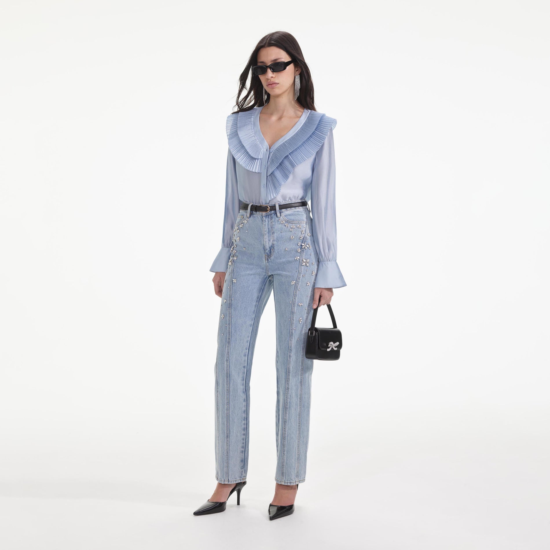 Side view of a woman wearing the Blue Satin Organza Blouse