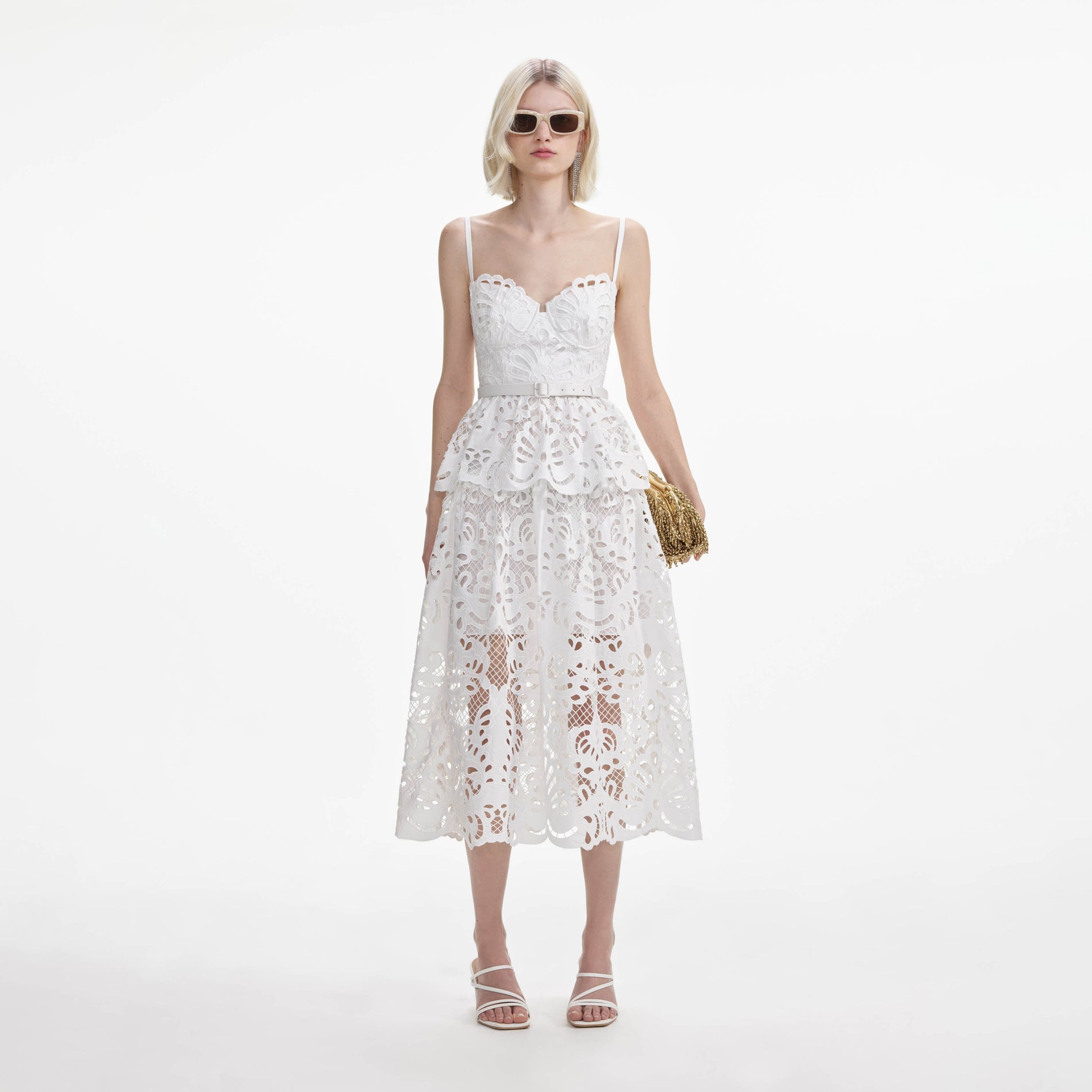 Front view of a woman wearing the White Cotton Lace Tiered Midi Dress