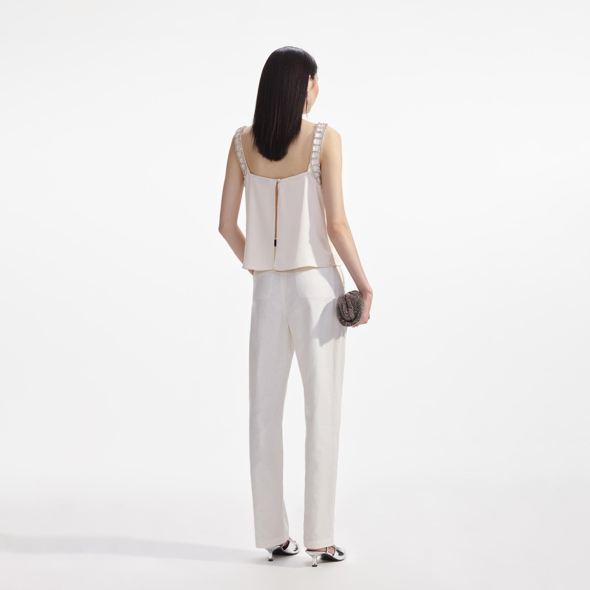 Back view of a woman wearing the Cream Satin Diamante Bralette Top