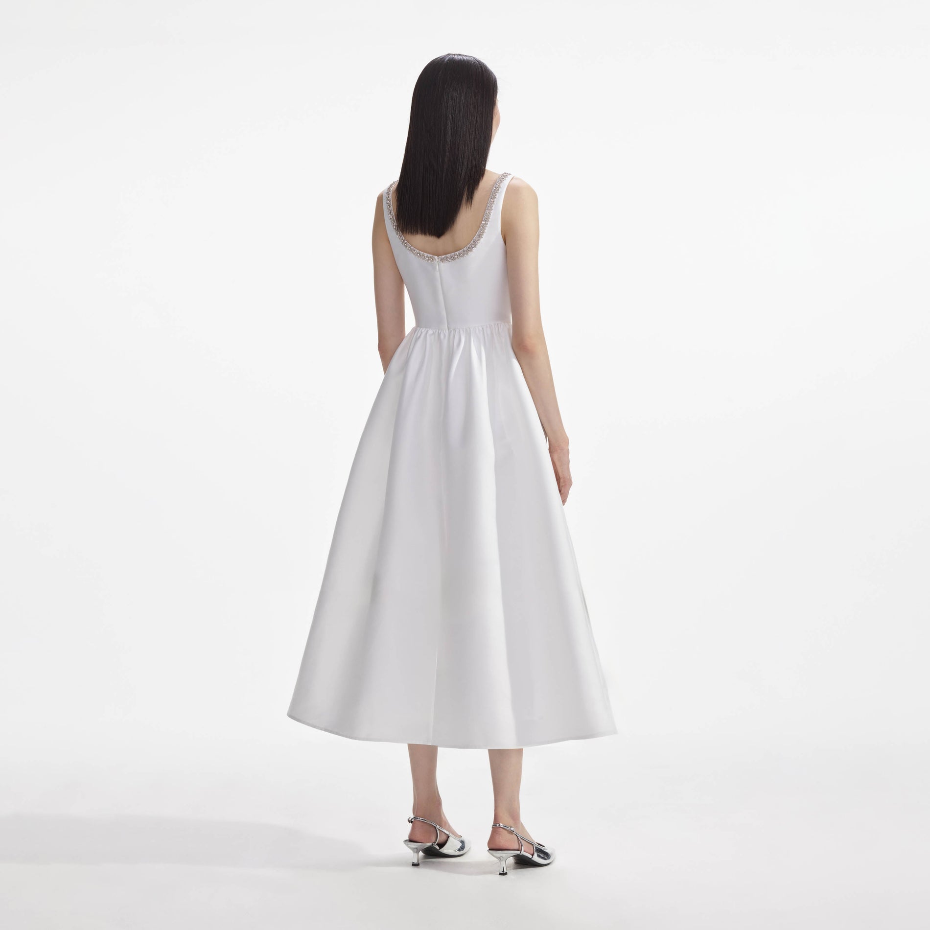 Back view of a woman wearing the White Taffeta Diamante Midi Dress