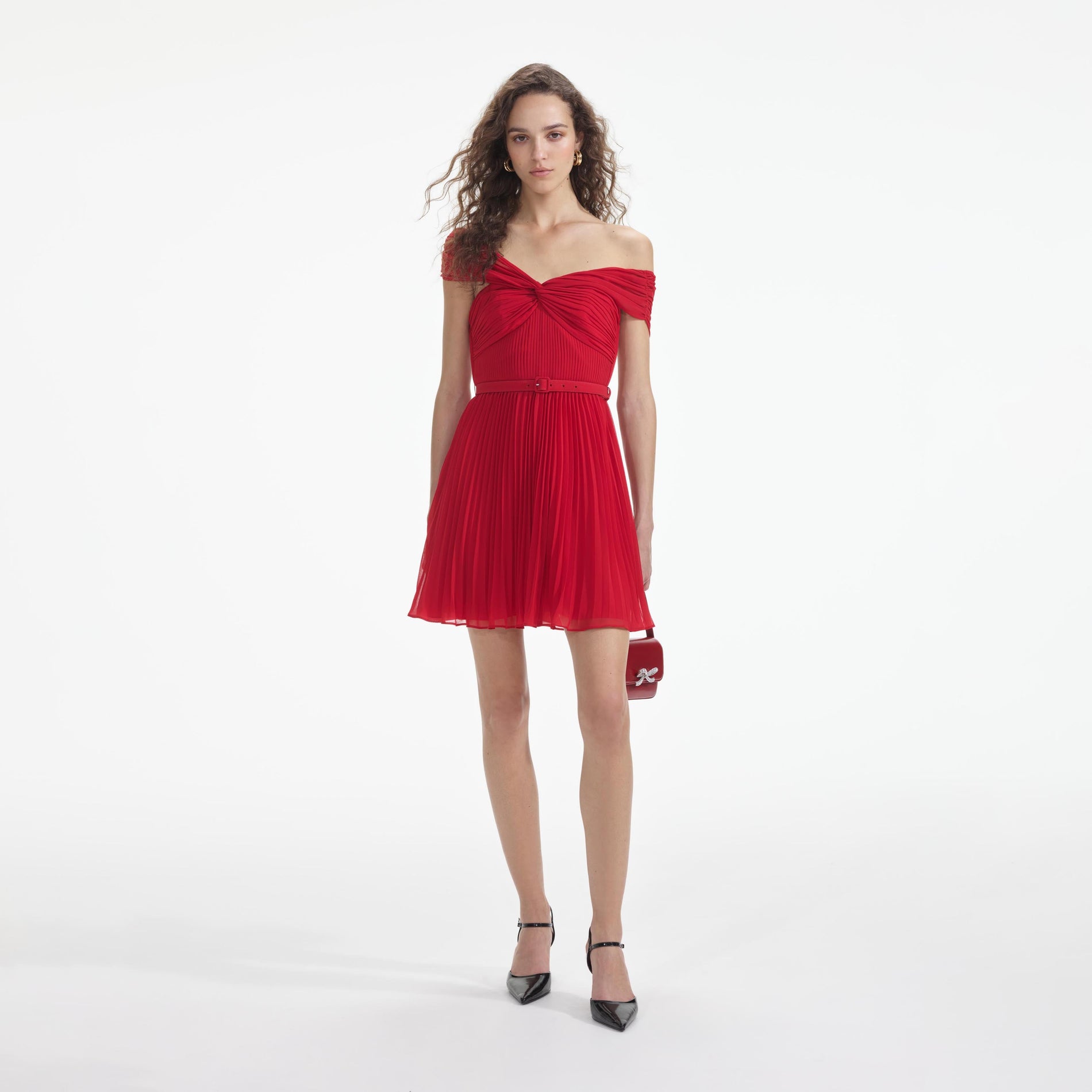 Front view of a woman wearing the Red Off Shoulder Chiffon Mini Dress