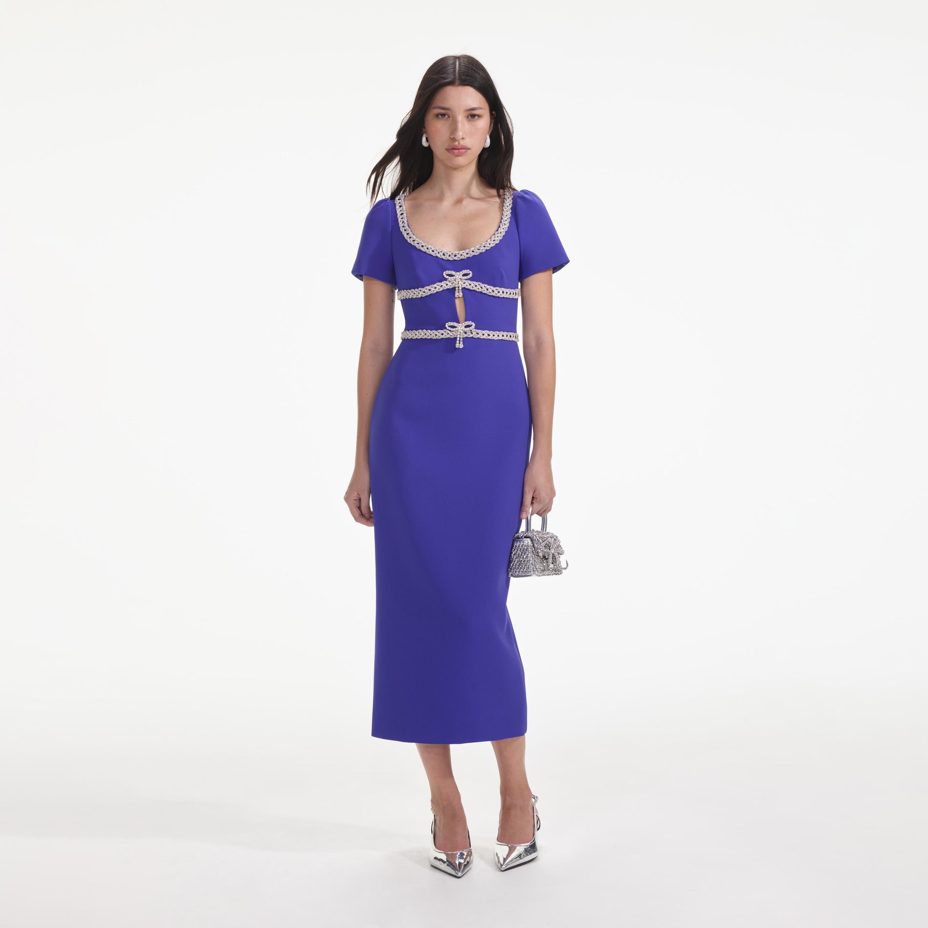 Front view of a woman wearing the Blue Diamante Bow Trim Midi Dress