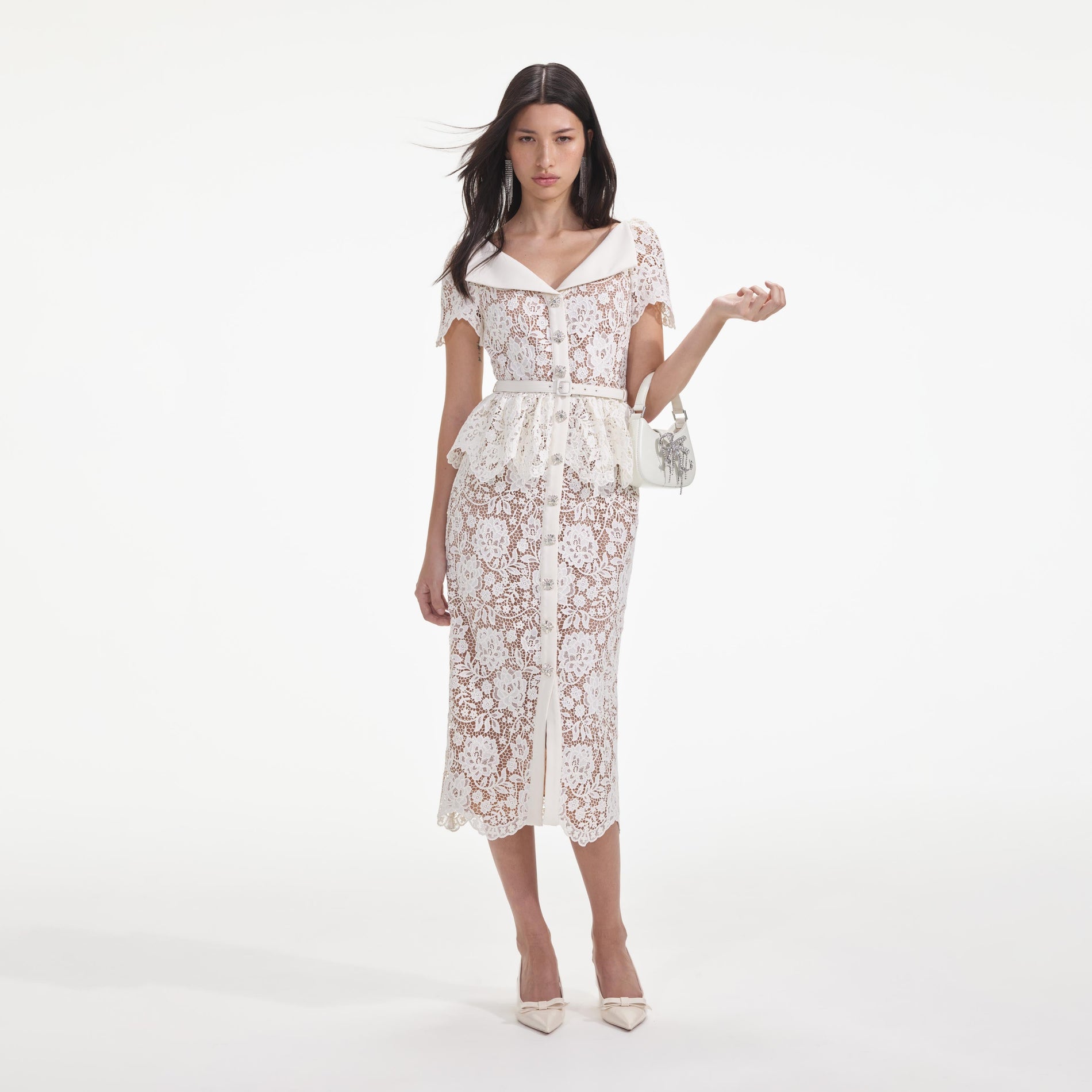 Front view of a woman wearing the Cream Lace Peplum Midi Dress