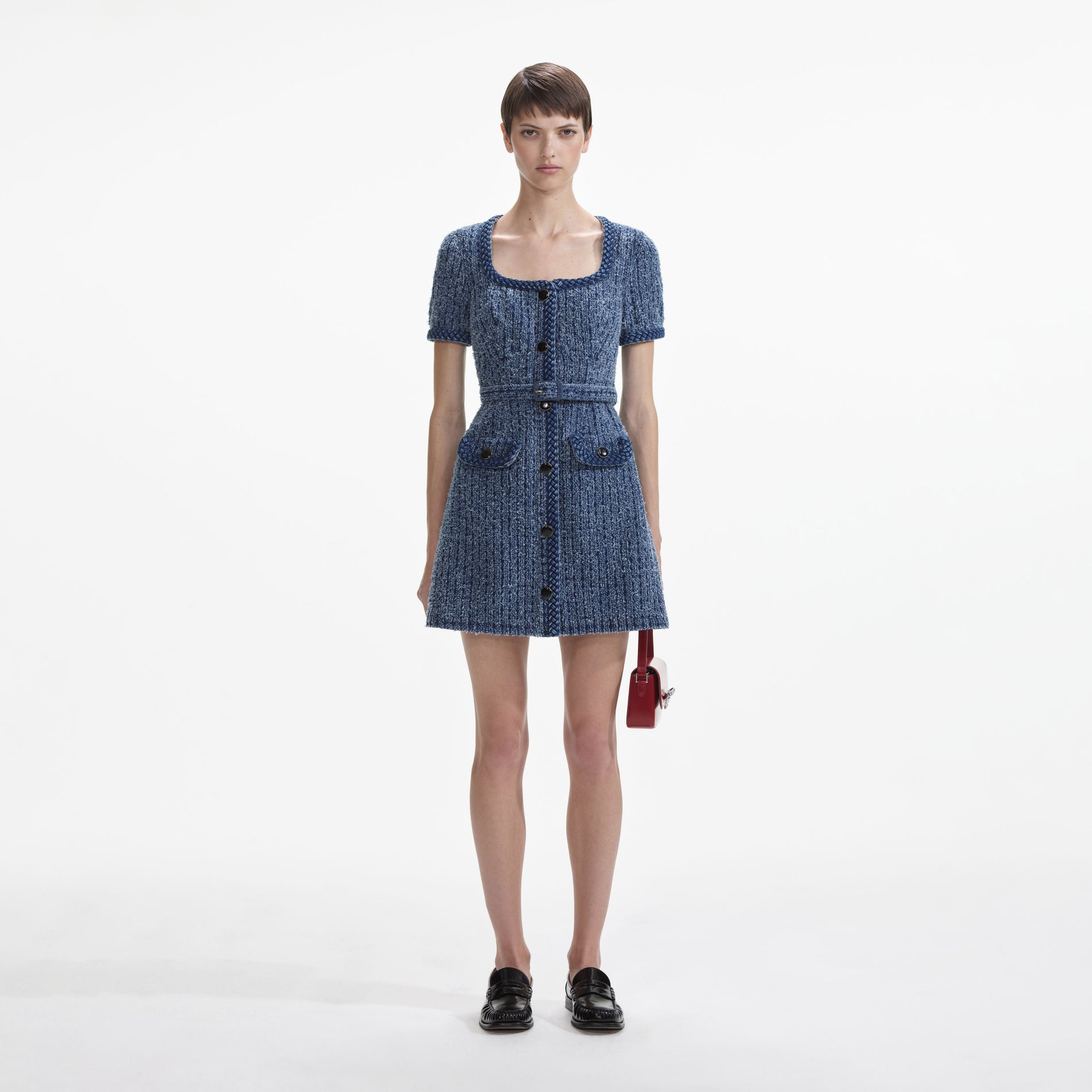 Front view of a woman wearing the Textured Denim Short Sleeve Mini Dress