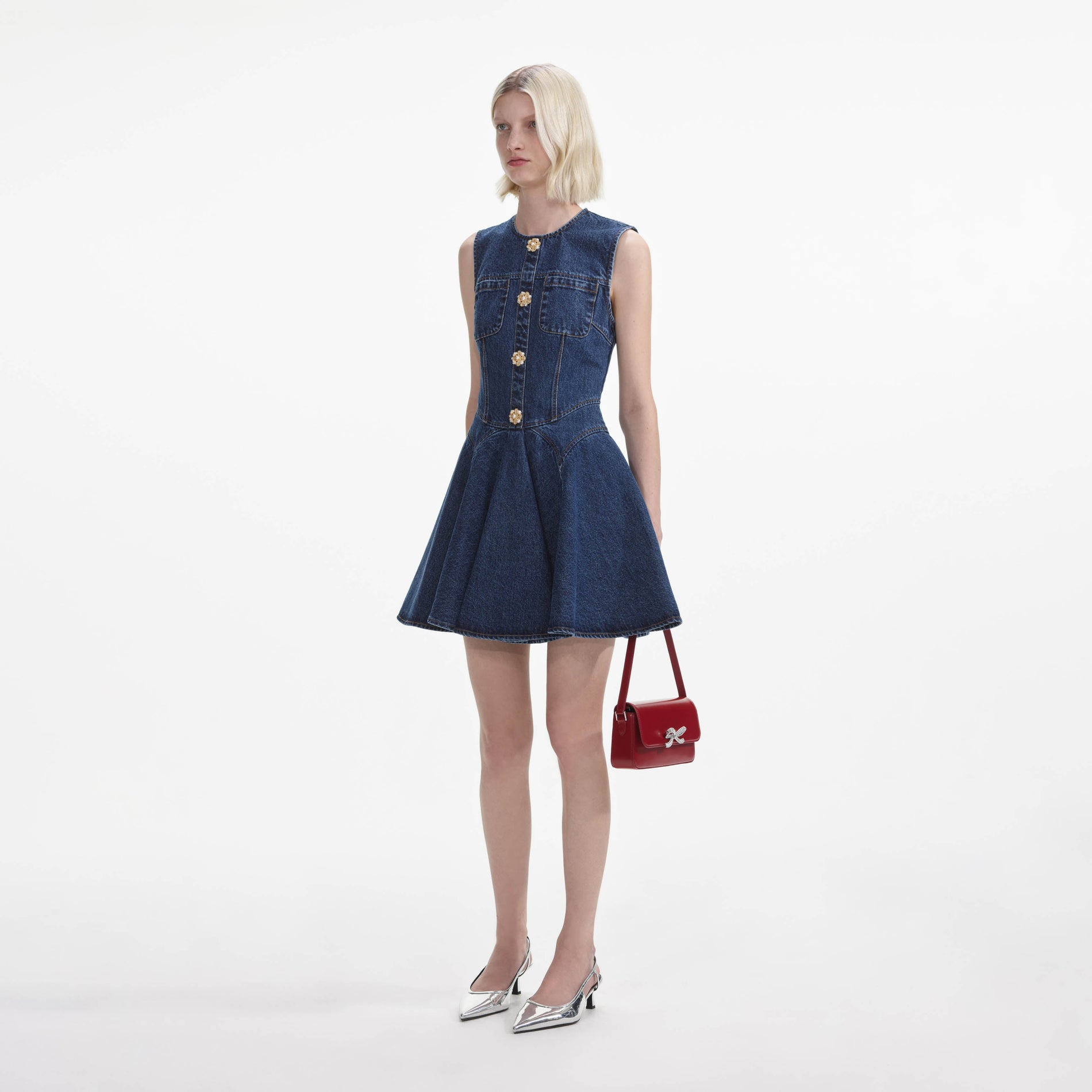 Side view of a woman wearing the Denim Skater Mini Dress