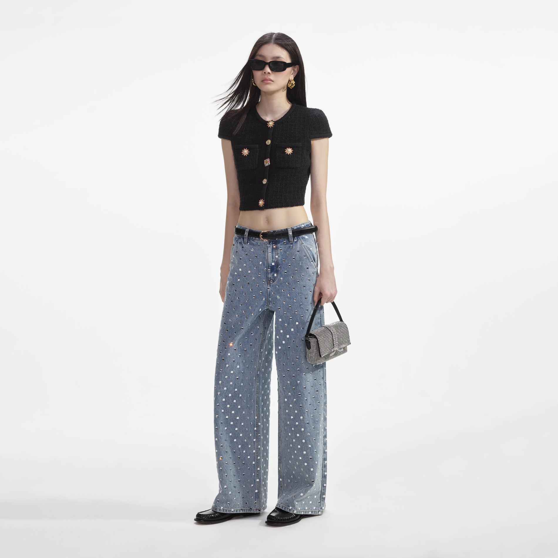 Side view of a woman wearing the Square Rhinestone Denim Jeans