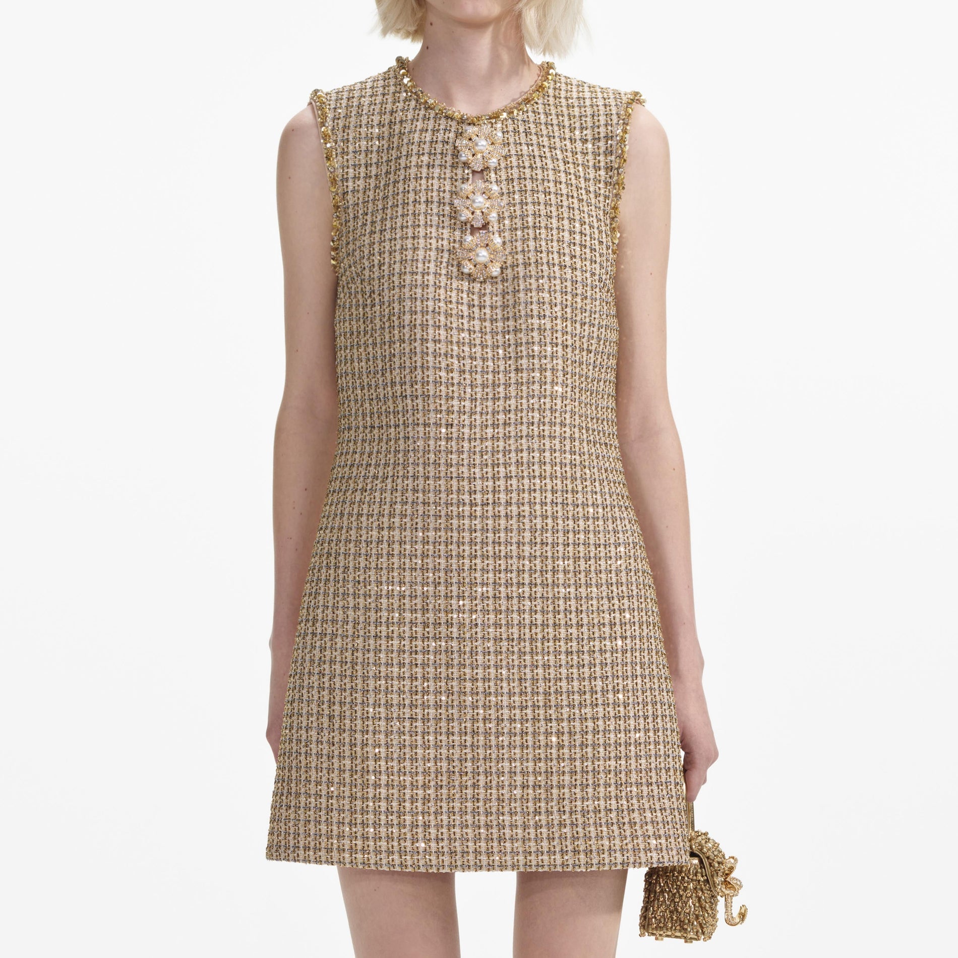 A close up of a woman wearing the Gold Boucle Embellished Mini Dress