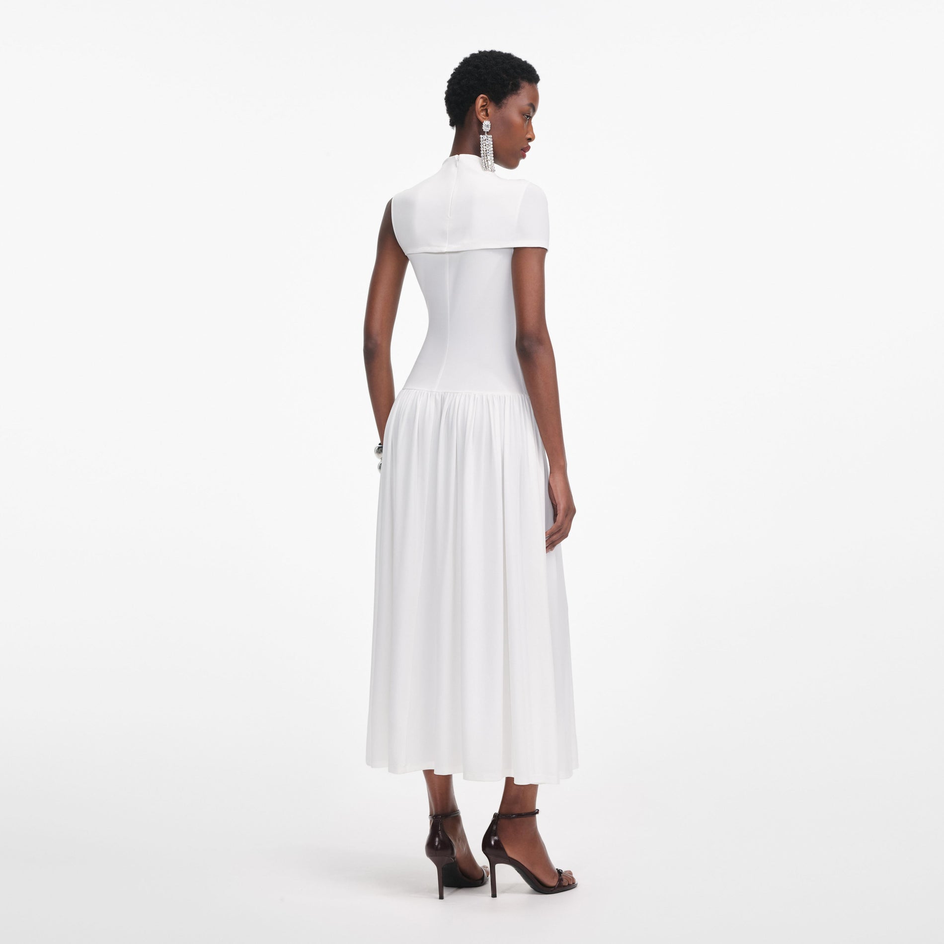 Back view of a woman wearing the White Jersey Cut Out Midi Dress