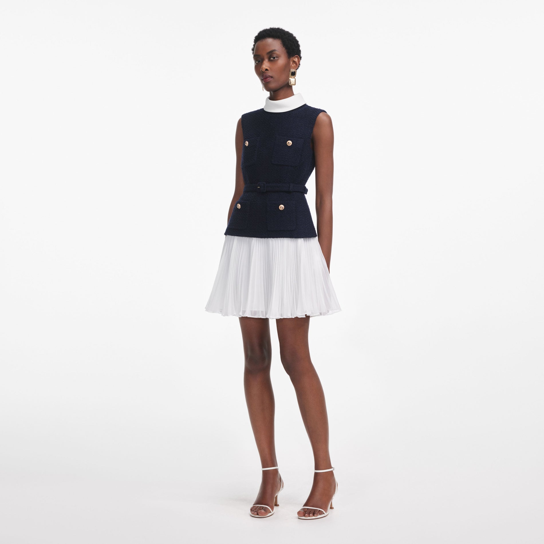 Side view of a woman wearing the Navy Boucle And Chiffon Mini Dress