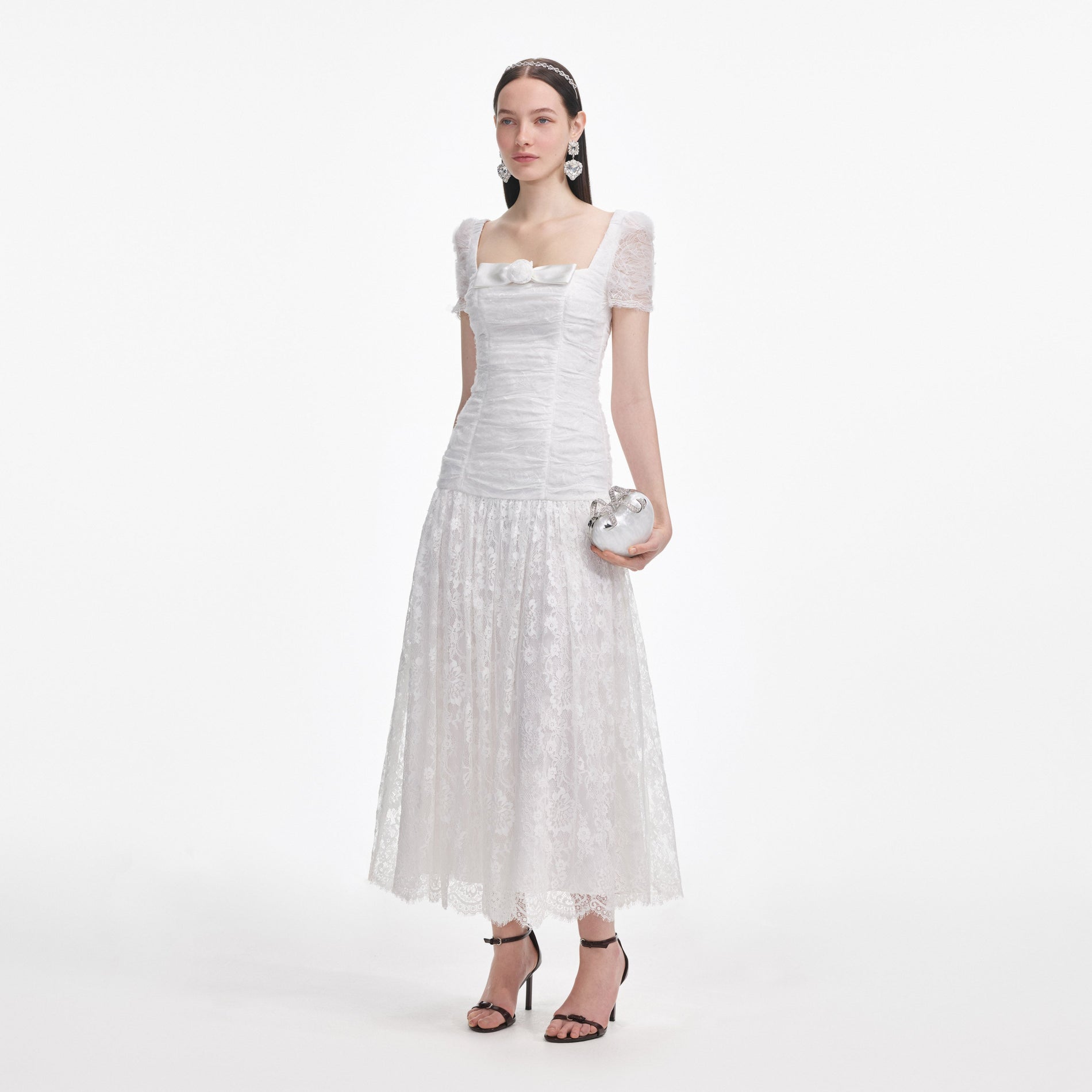 Side view of a woman wearing the White Tulle Lace Gathered Midi Dress