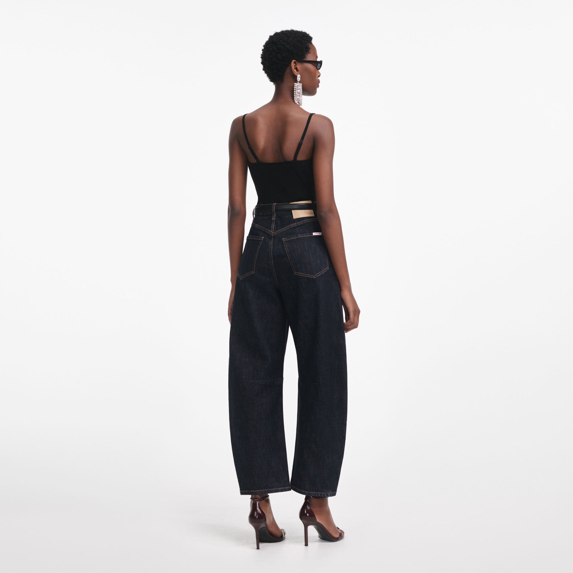 Back view of a woman wearing the Black Lace Trim Rib Knit Top