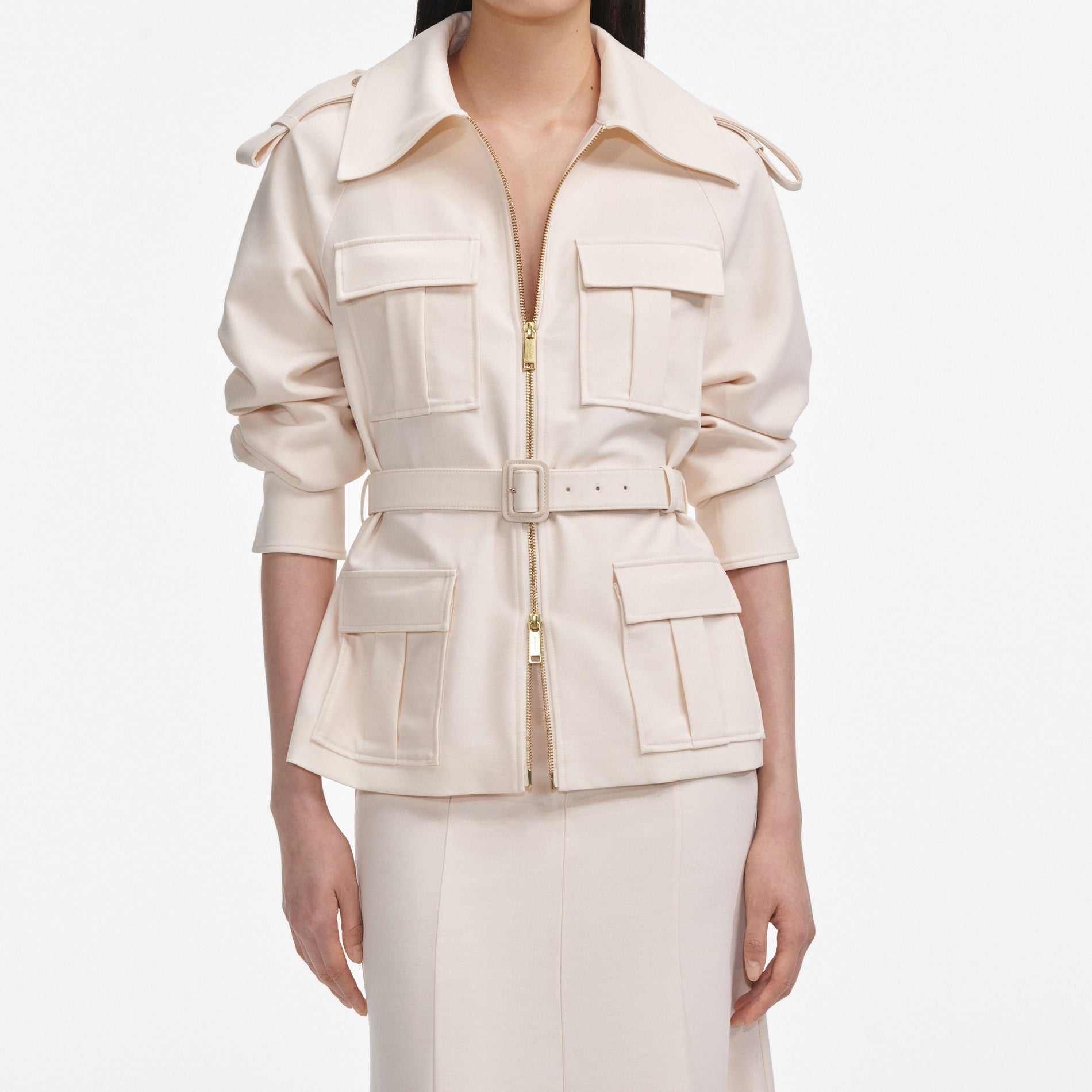 A close up of a woman wearing the Cream Twill Midi Dress