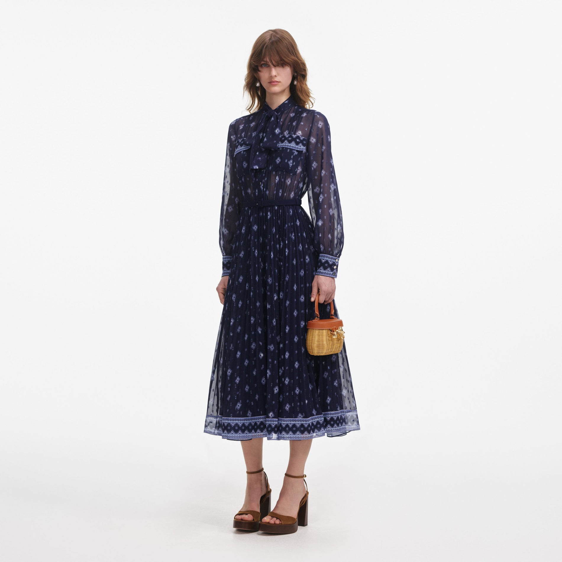 Side view of a woman wearing the Navy Printed Chiffon Midi Dress