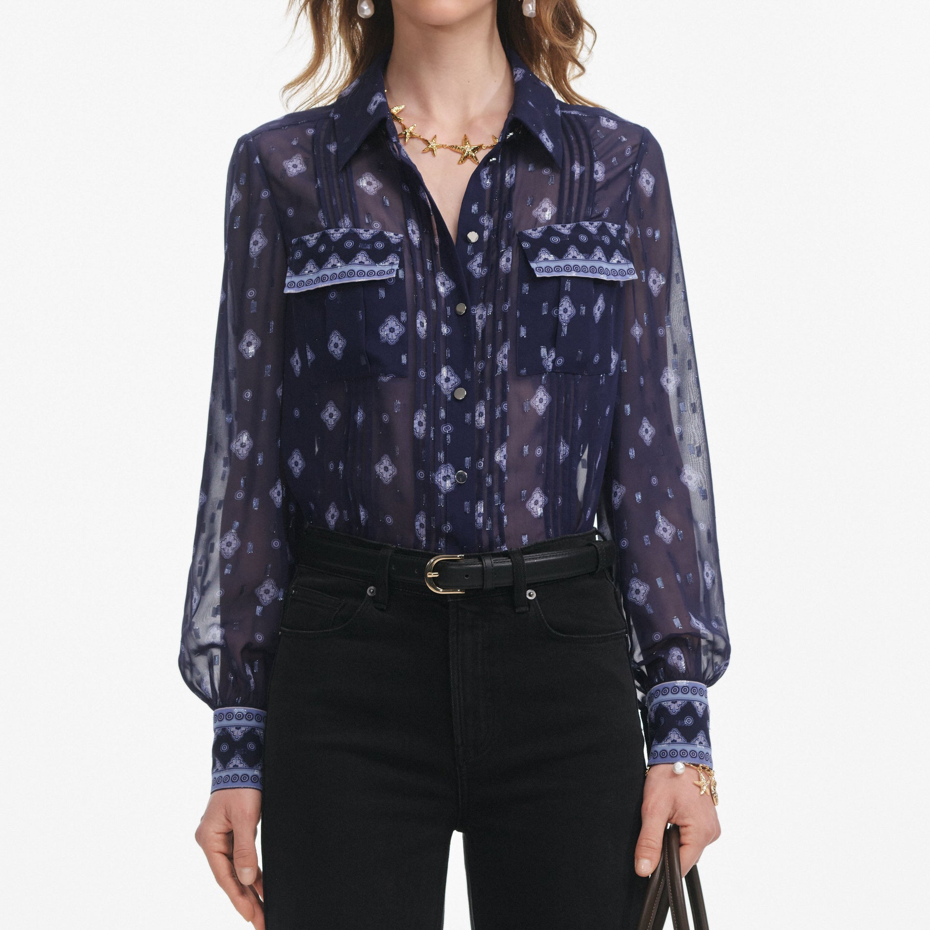 A close up of a woman wearing the Navy Printed Chiffon Blouse