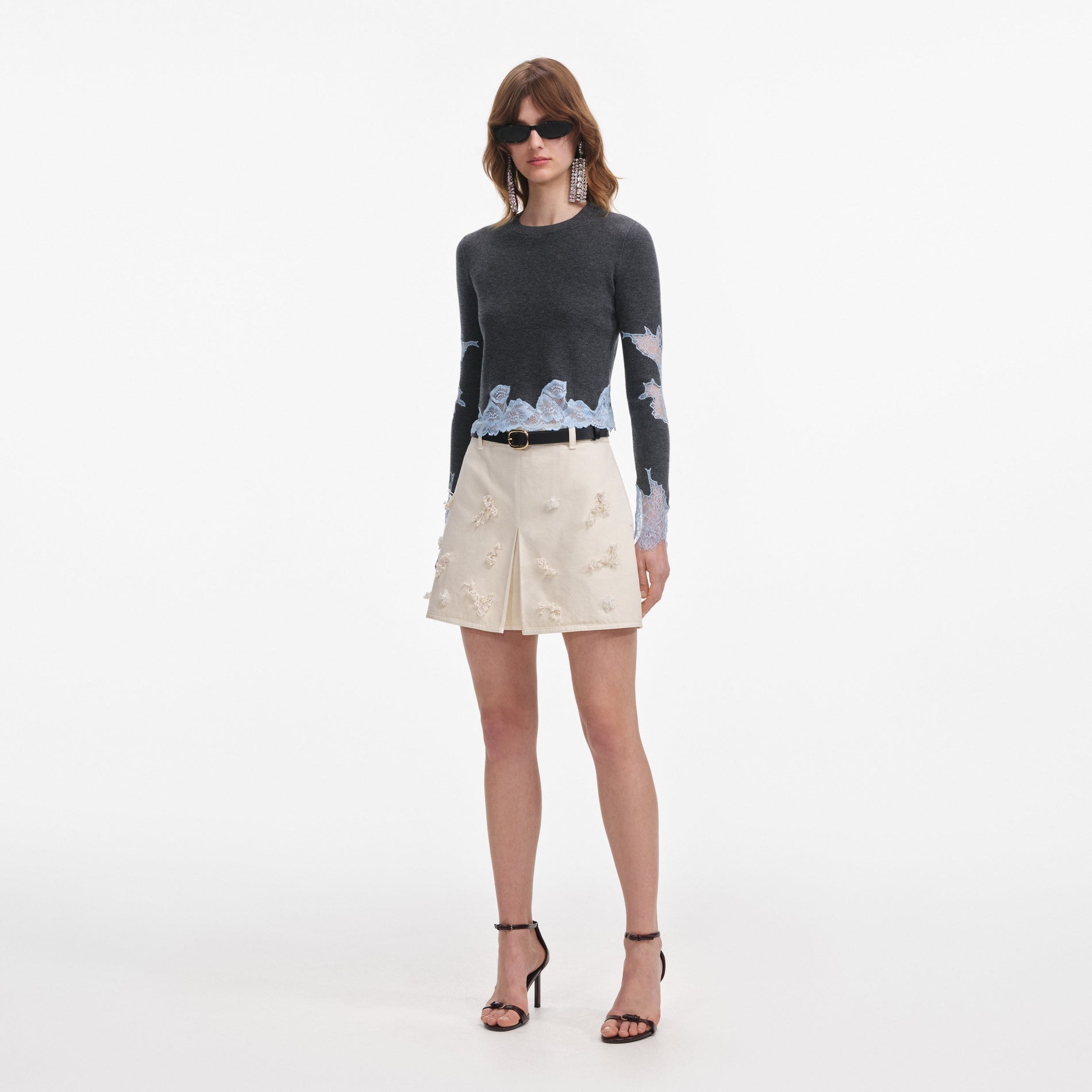 Side view of a woman wearing the Grey Contrast Lace Jumper