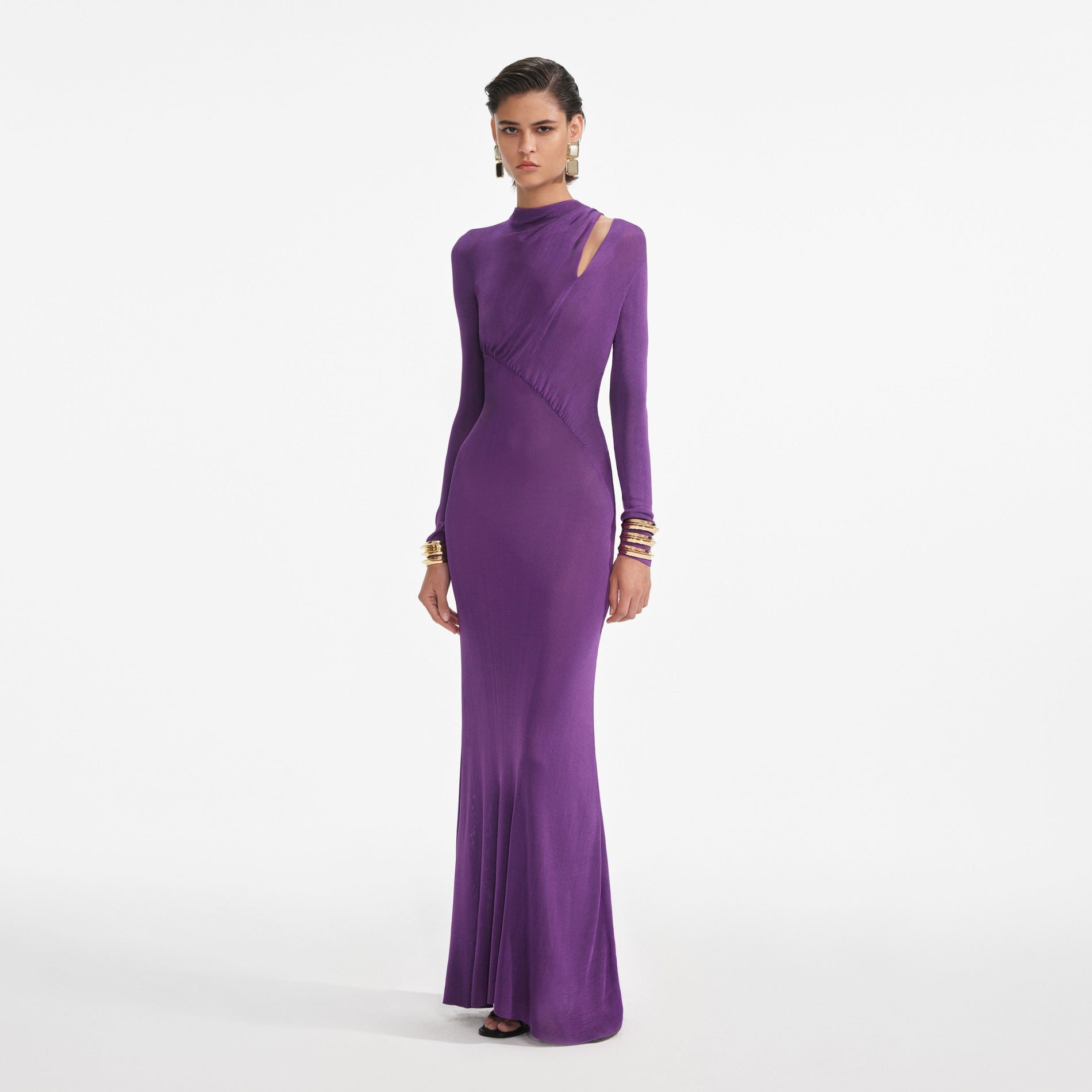 Side view of a woman wearing the Purple Cut Out Viscose Knit Maxi Dress