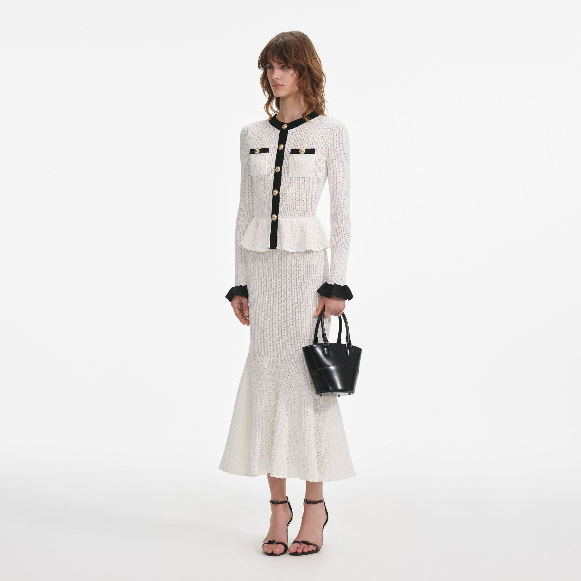 Side view of a woman wearing the White Pointelle Knit Contrast Midi Dress